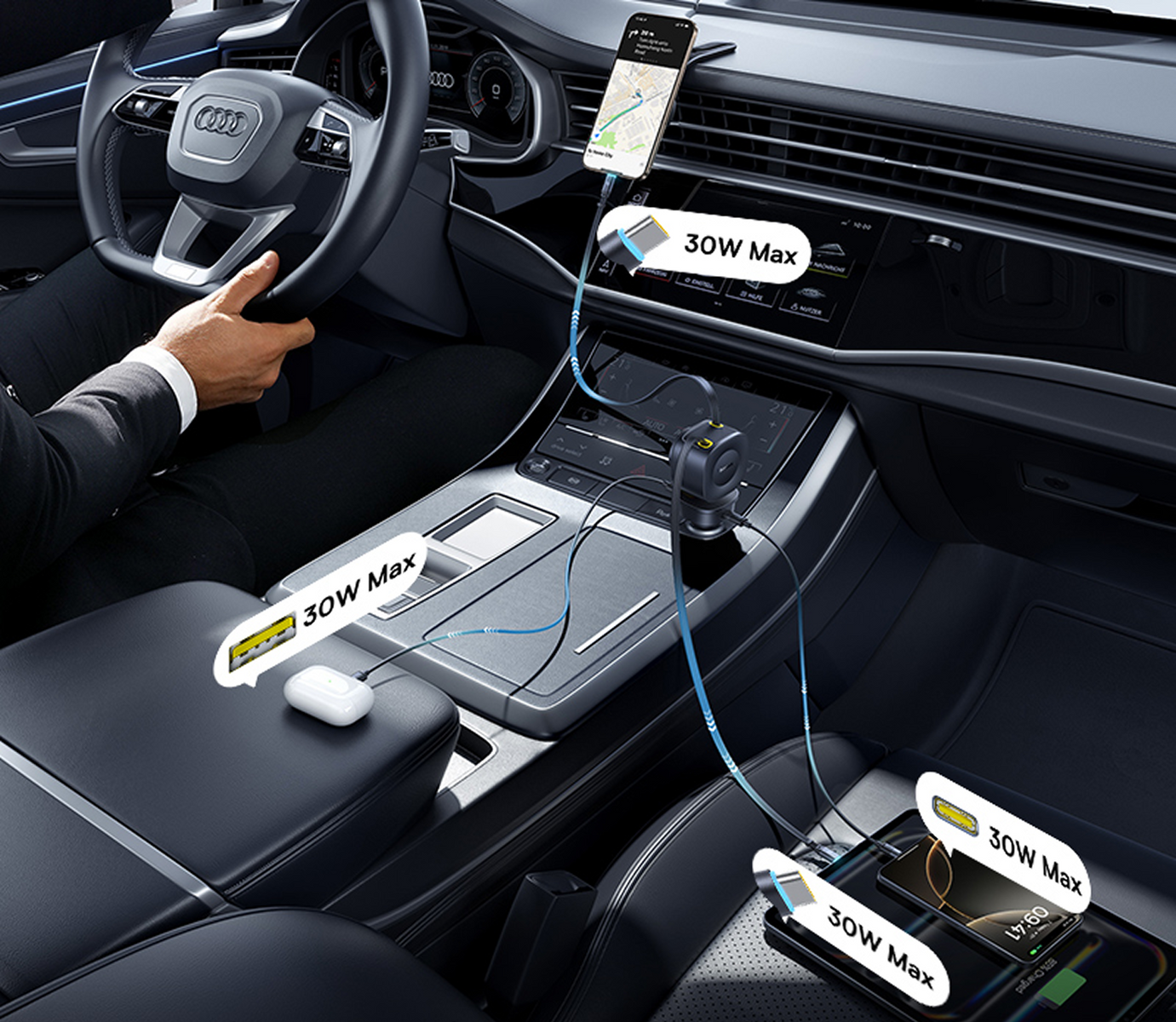 Dentro de un coche, un teléfono se está cargando. Otros dispositivos se cargan con una etiqueta 30W Max. El conductor sostiene el volante.