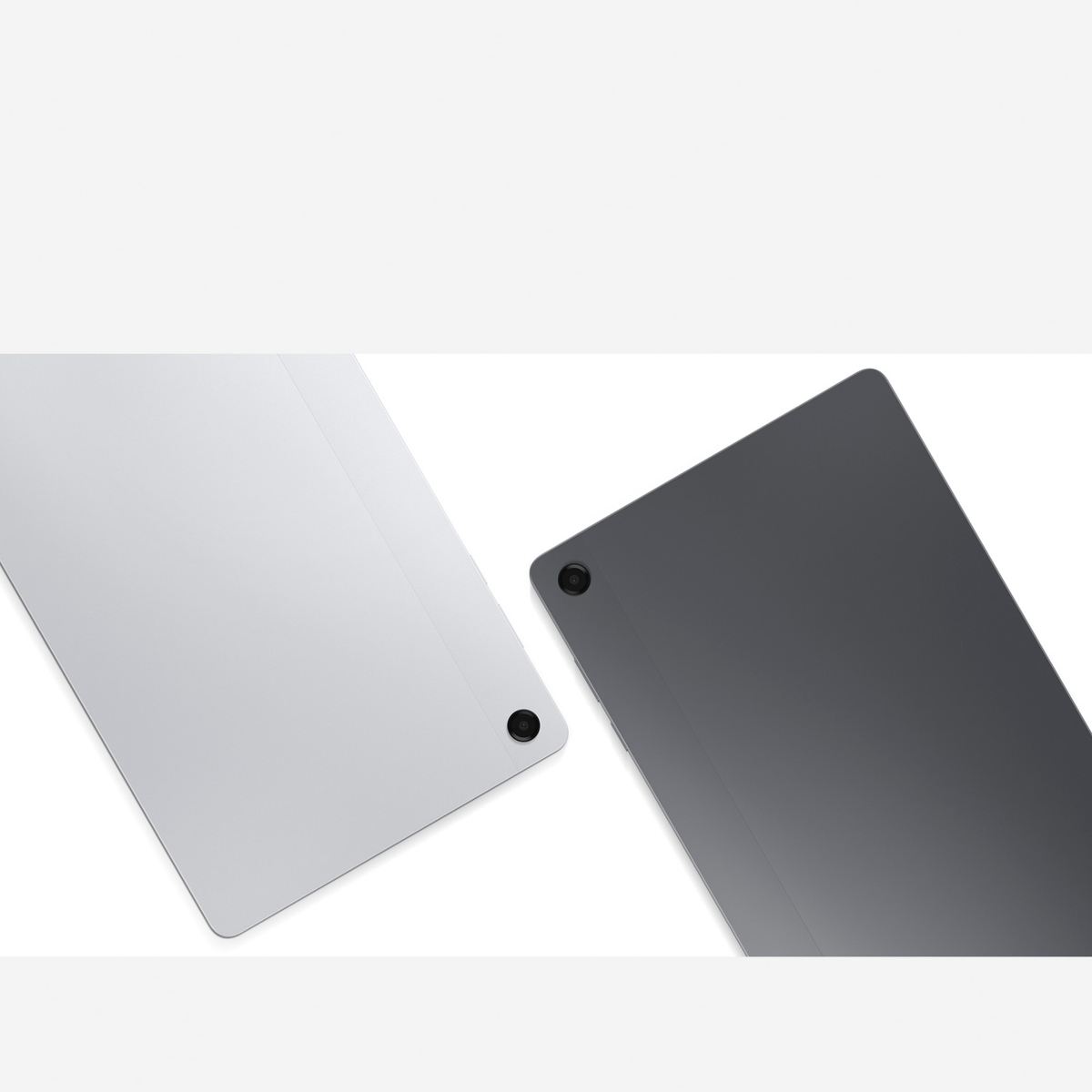 Wyświetlane są dwa tablety, jeden srebrny i jeden ciemnoszary. Każdy ma aparat z tyłu. Tło jest białe.