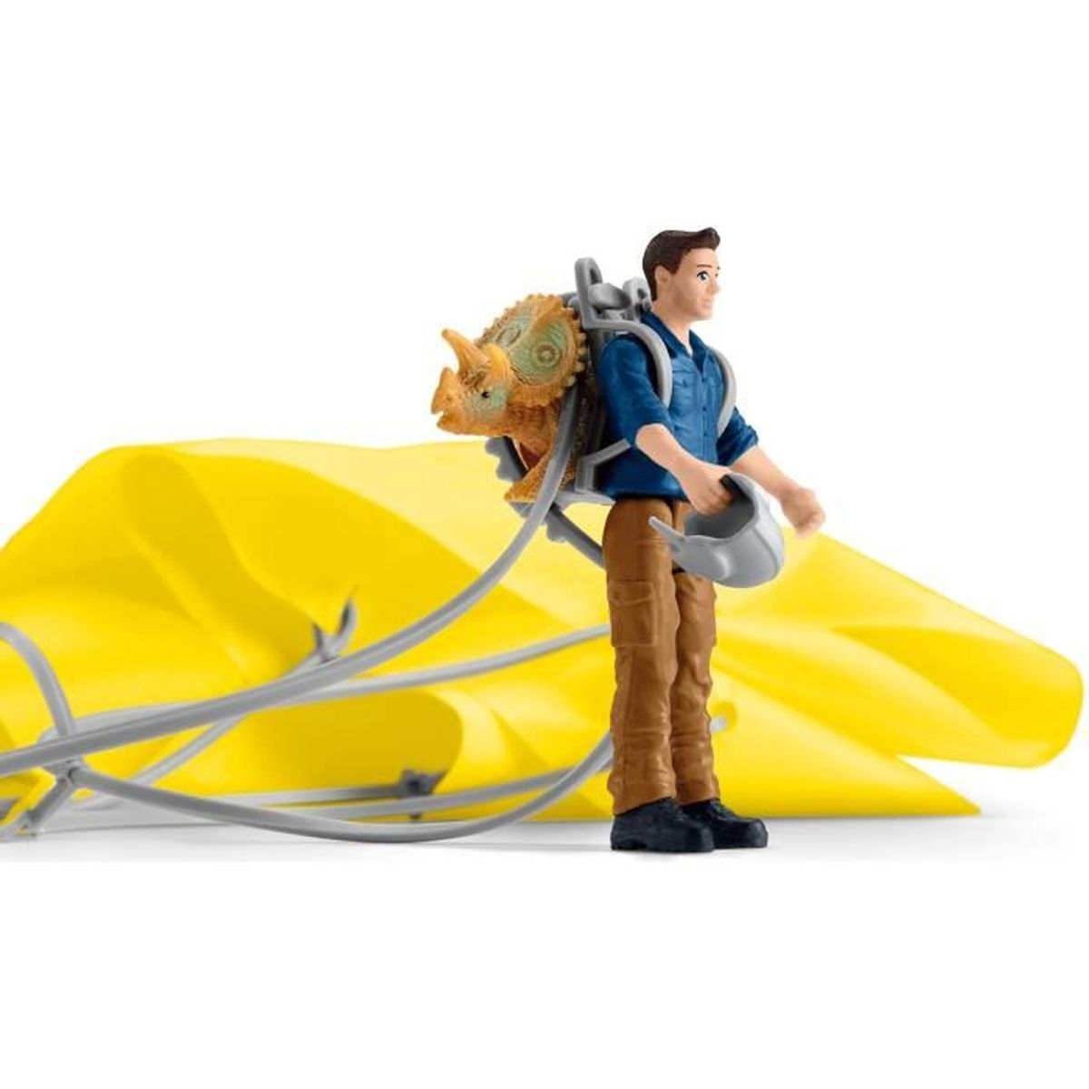 A man with a dinosaur backpack and a yellow cloth on a white background.