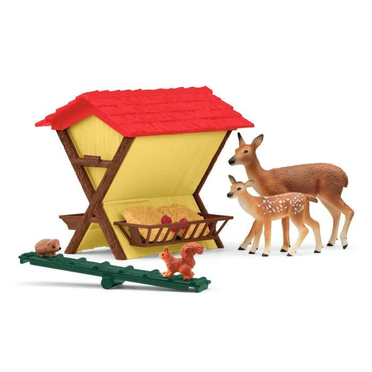 Eine Spielzeugszene mit einem rotbedachten gelben Gebäude, Rehen, Eichhörnchen, Igel und einer Wippe. Die Rehe sind braun, das Reh ist gefleckt.
