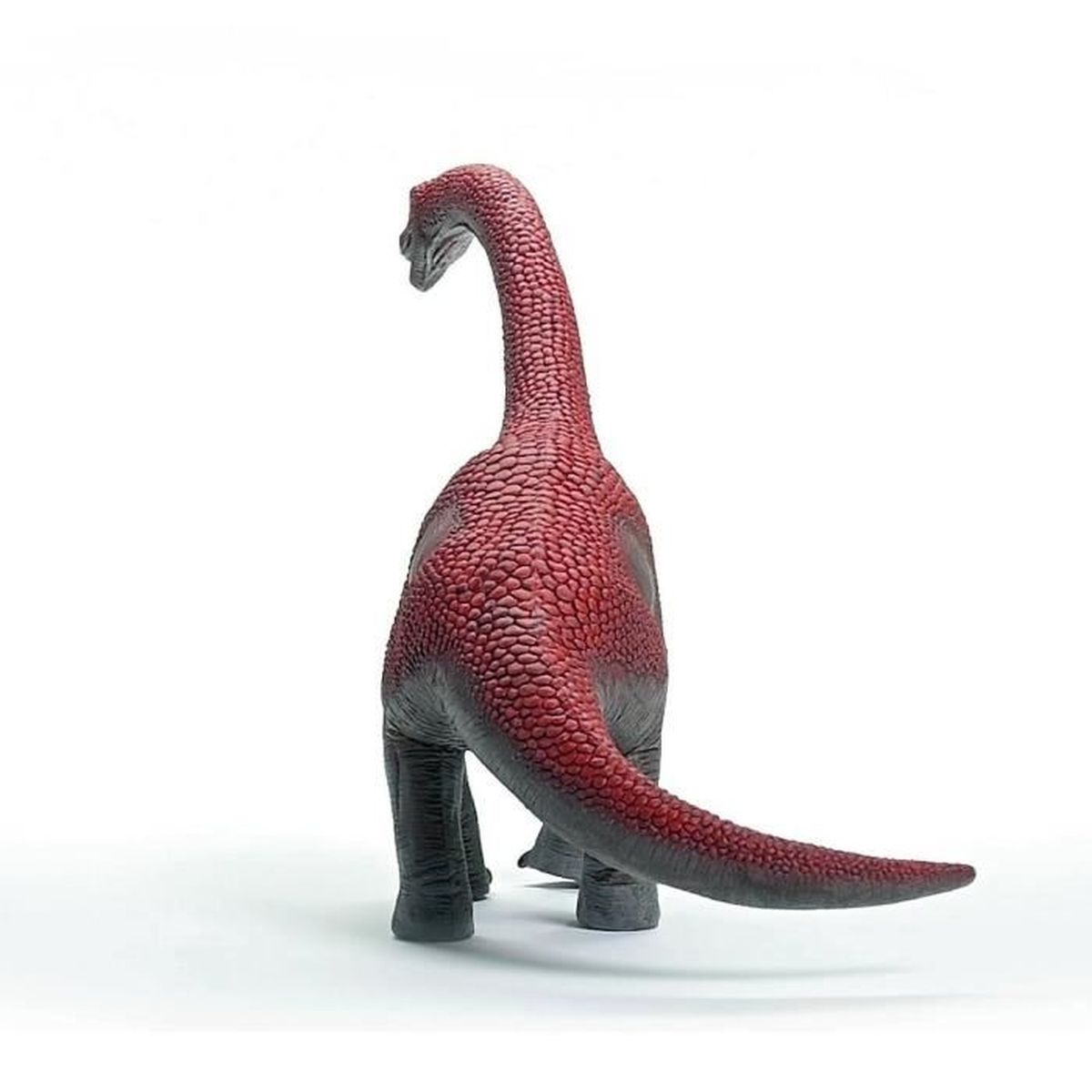 Un giocattolo di dinosauro rosso e grigio, rivolto all'indietro, su sfondo bianco. Il dinosauro ha collo e coda lunghi.