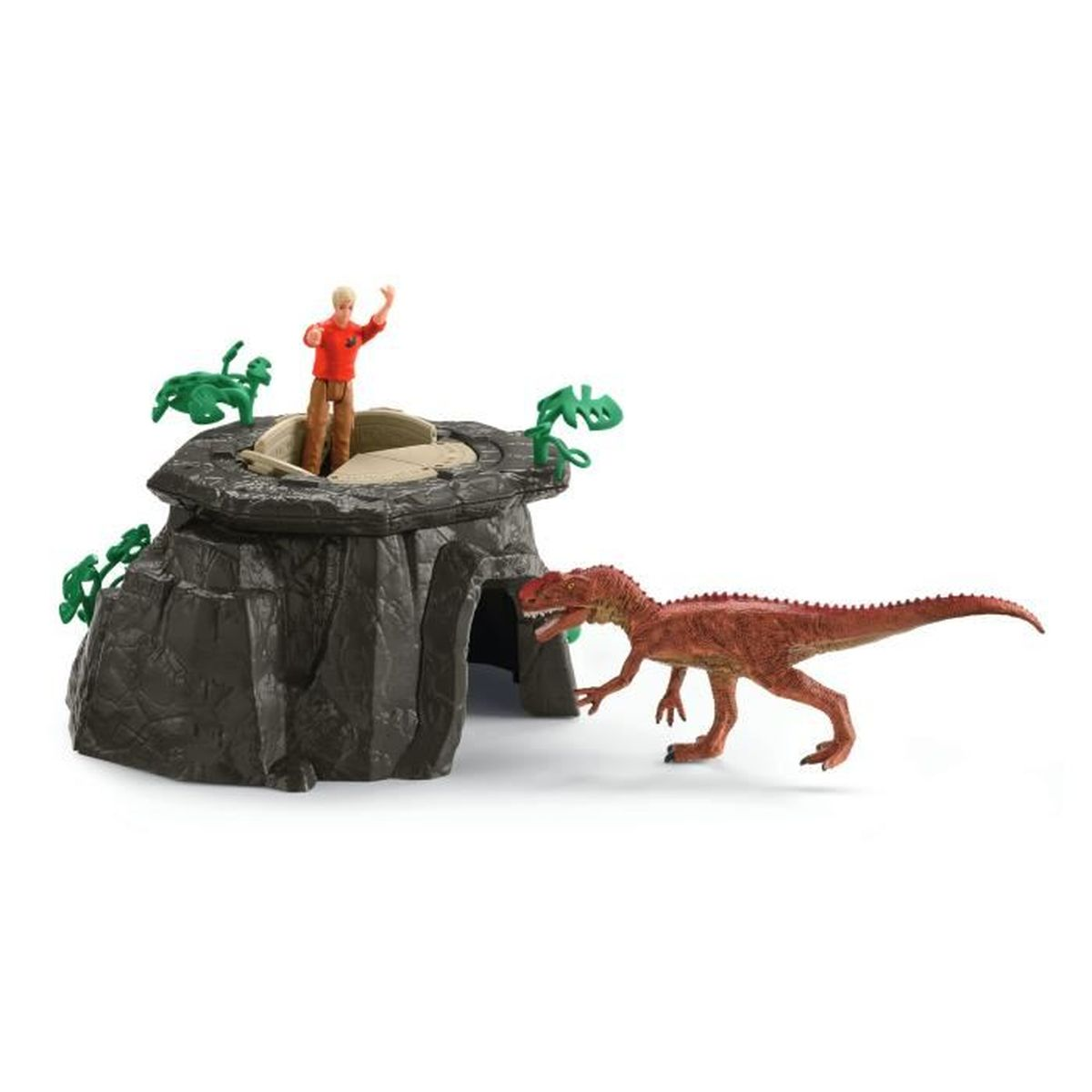 Eine Spielzeugszene zeigt eine Person auf einer Struktur und einen Dinosaurier. Die Struktur ist dunkelgrau. Der Dinosaurier ist braun.