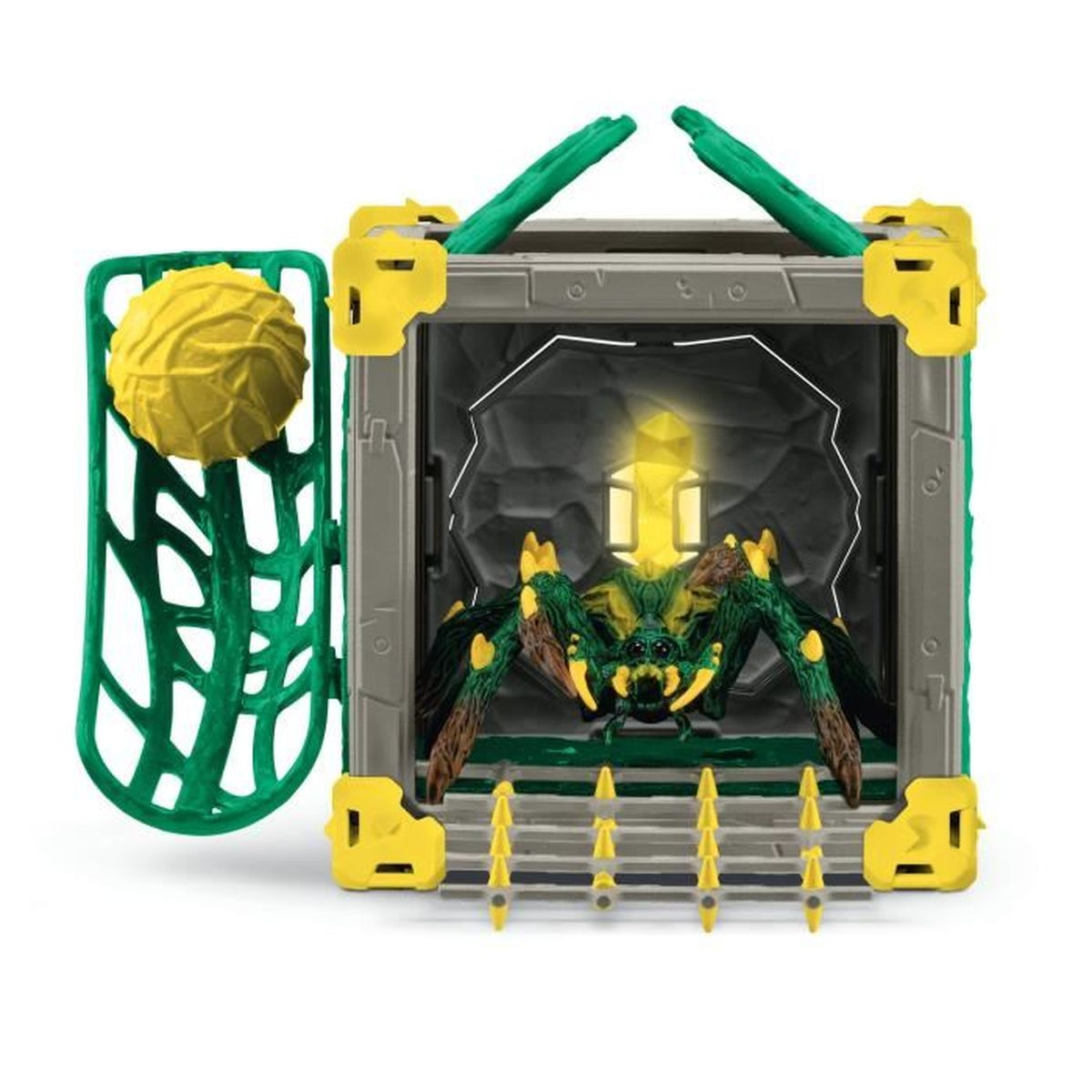 Spielzeugspinne in einem Käfig mit grünen und gelben Akzenten. Eine gelbe Kugel und ein grüner Käfig an der Seite. Die Spinne hat grüne und braune Beine.