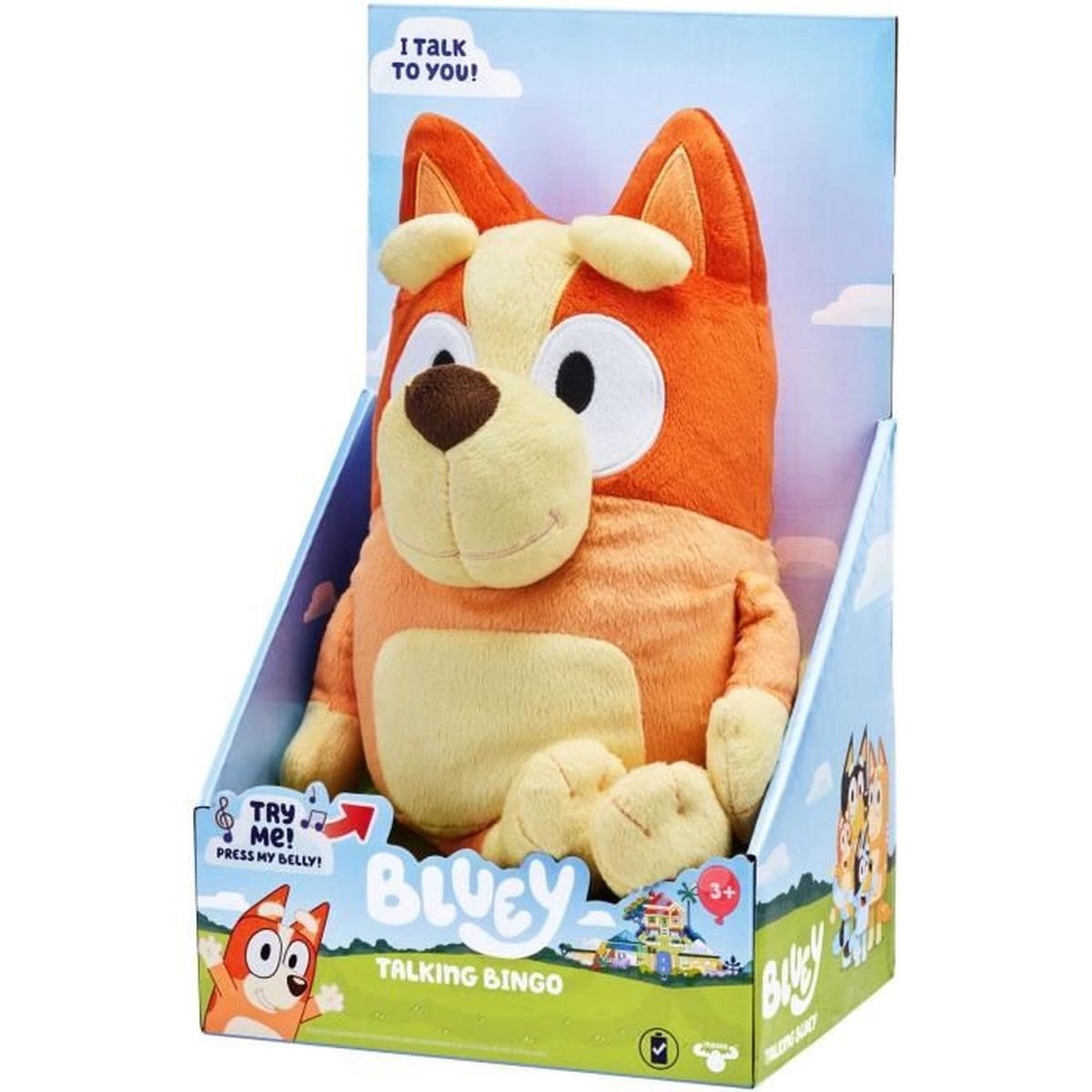 Une peluche Bingo parlante de Bluey dans sa boîte. Le jouet est orange et beige. La boîte indique "I talk to you!" et "Try me!".