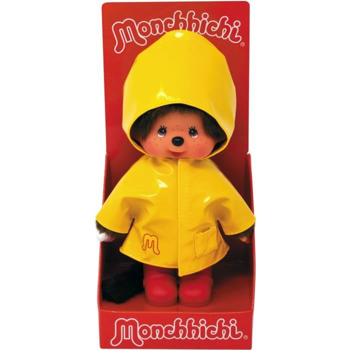 Lalka Monchhichi w żółtym płaszczu przeciwdeszczowym i kapturze, czerwonych butach, w czerwonym pudełku, z logo Monchhichi.