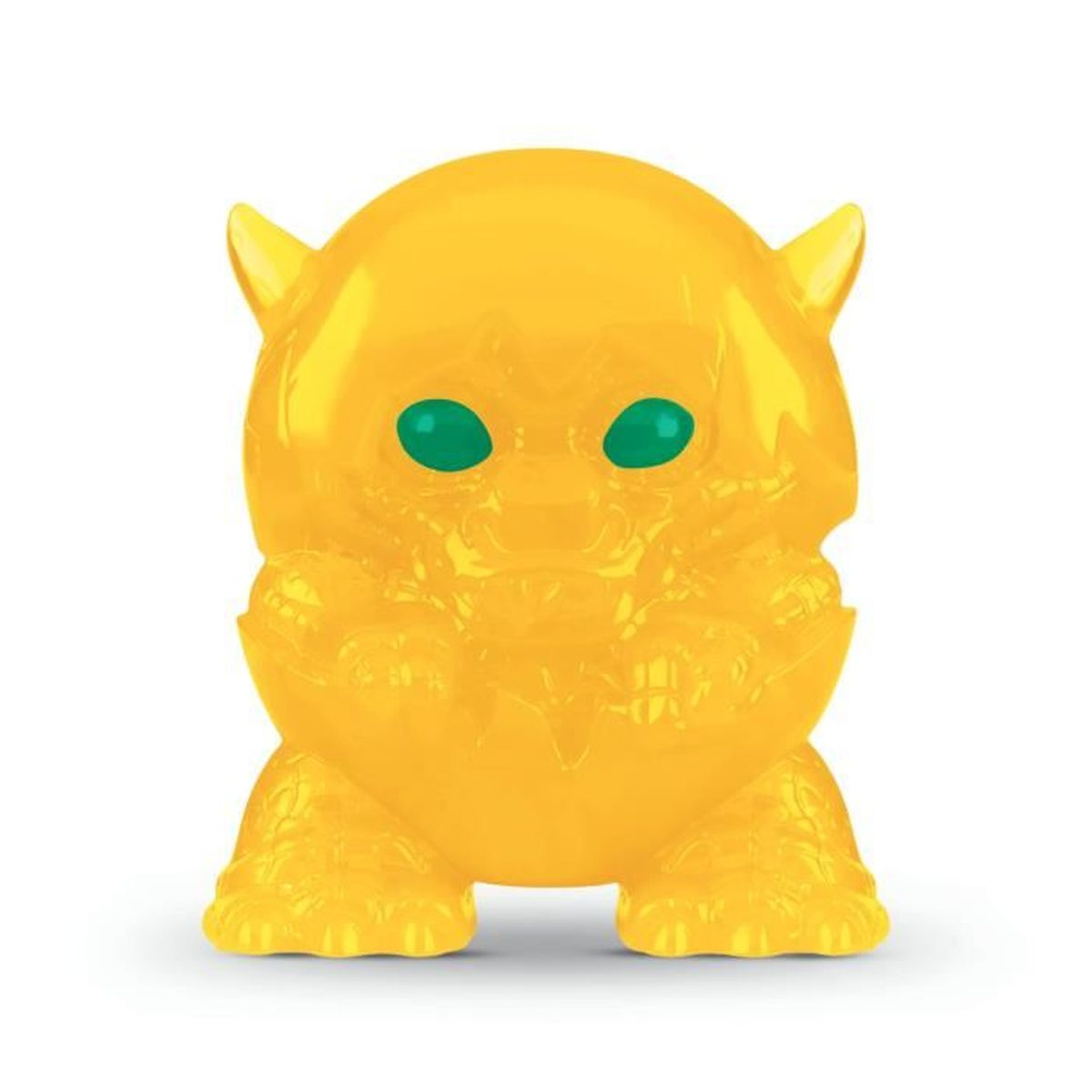Żółty, przezroczysty potwór-zabawka z zielonymi oczami, dwoma małymi rogami i krępymi nogami, na białym tle.