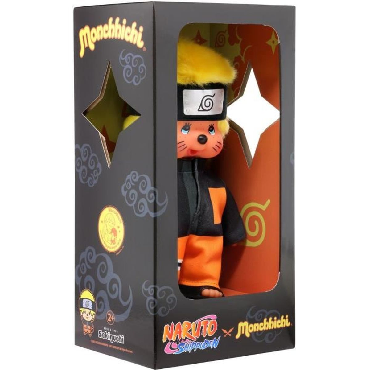 Eine Naruto-Monchhichi-Puppe in einer Box. Die Puppe trägt ein orange-schwarzes Outfit. Die Box hat einen sternförmigen Ausschnitt.
