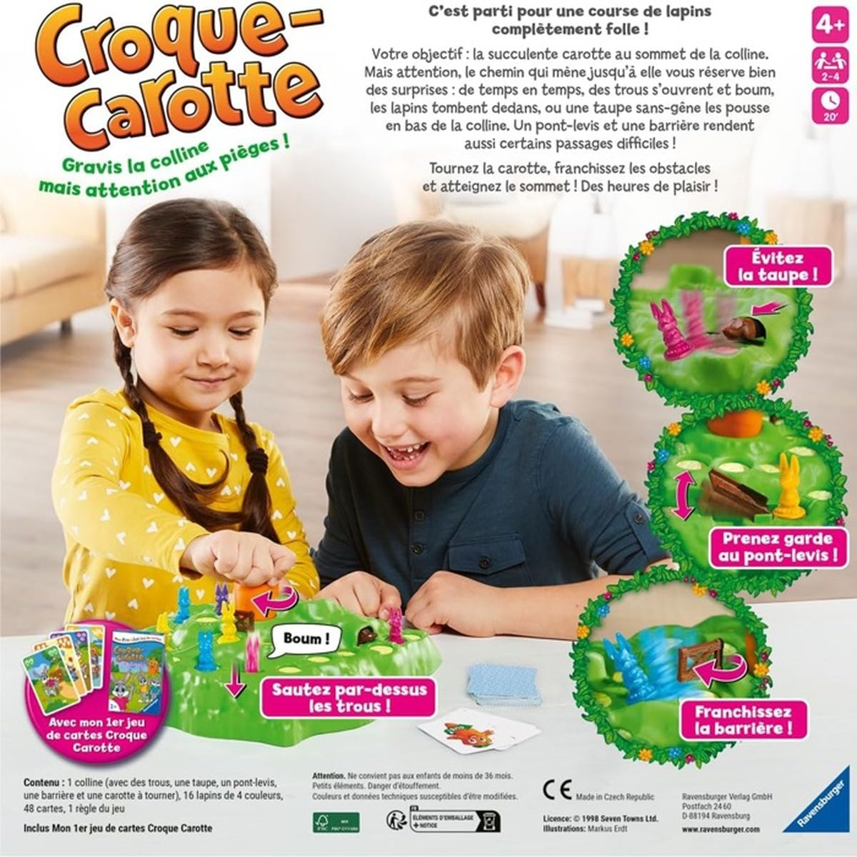 Zwei Kinder spielen ein Brettspiel mit einem grünen Hügel, Hasen und Karten.