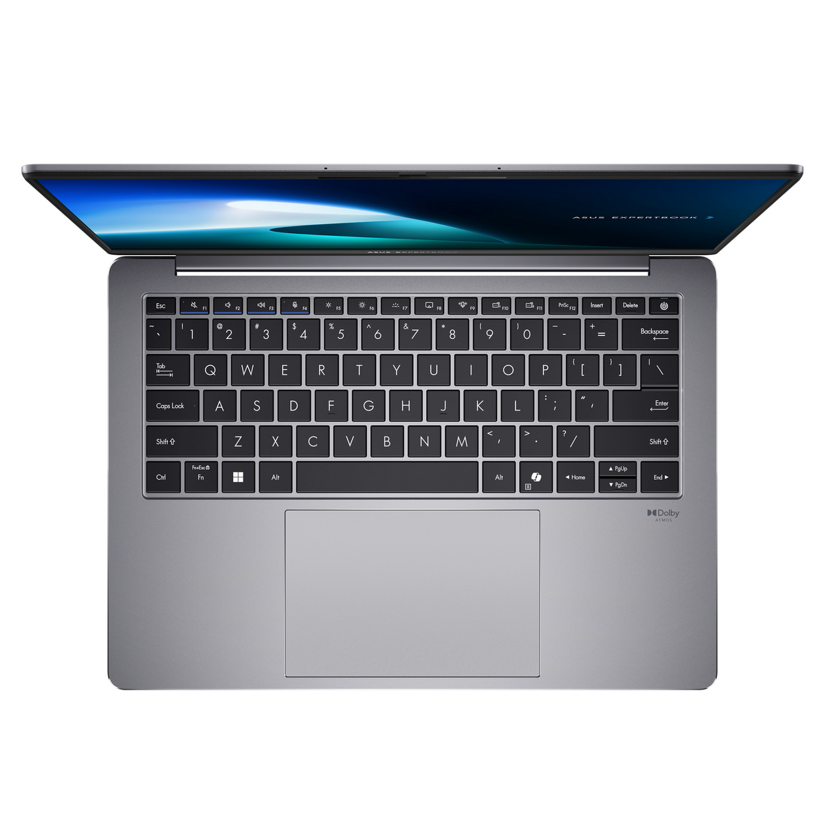 Una computadora portátil gris está abierta, mostrando el teclado y la pantalla. La pantalla muestra una imagen azul y blanca. El teclado es visible.