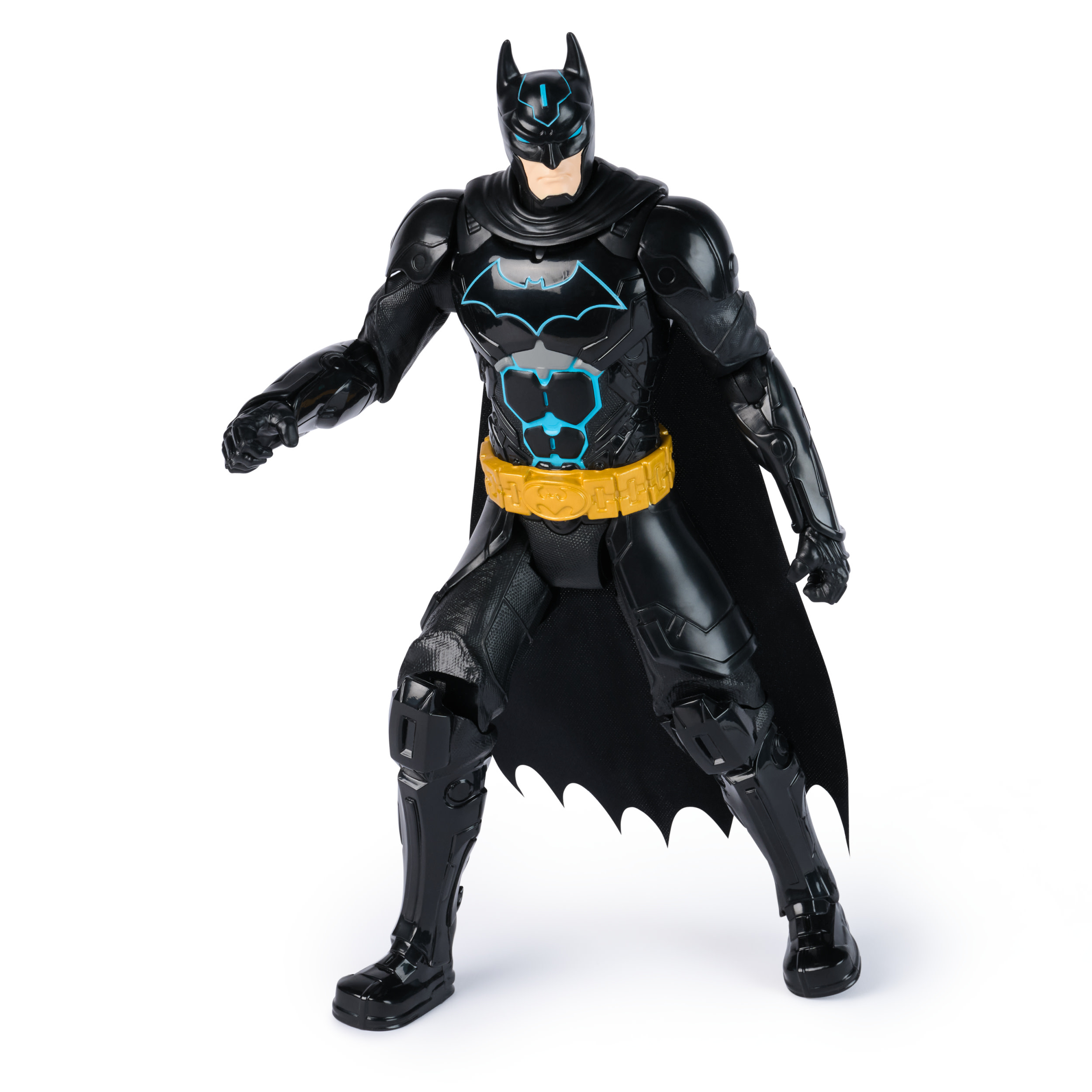 Eine Batman-Actionfigur steht auf einer weißen Oberfläche. Sie ist schwarz mit blauen Akzenten und einem gelben Gürtel.