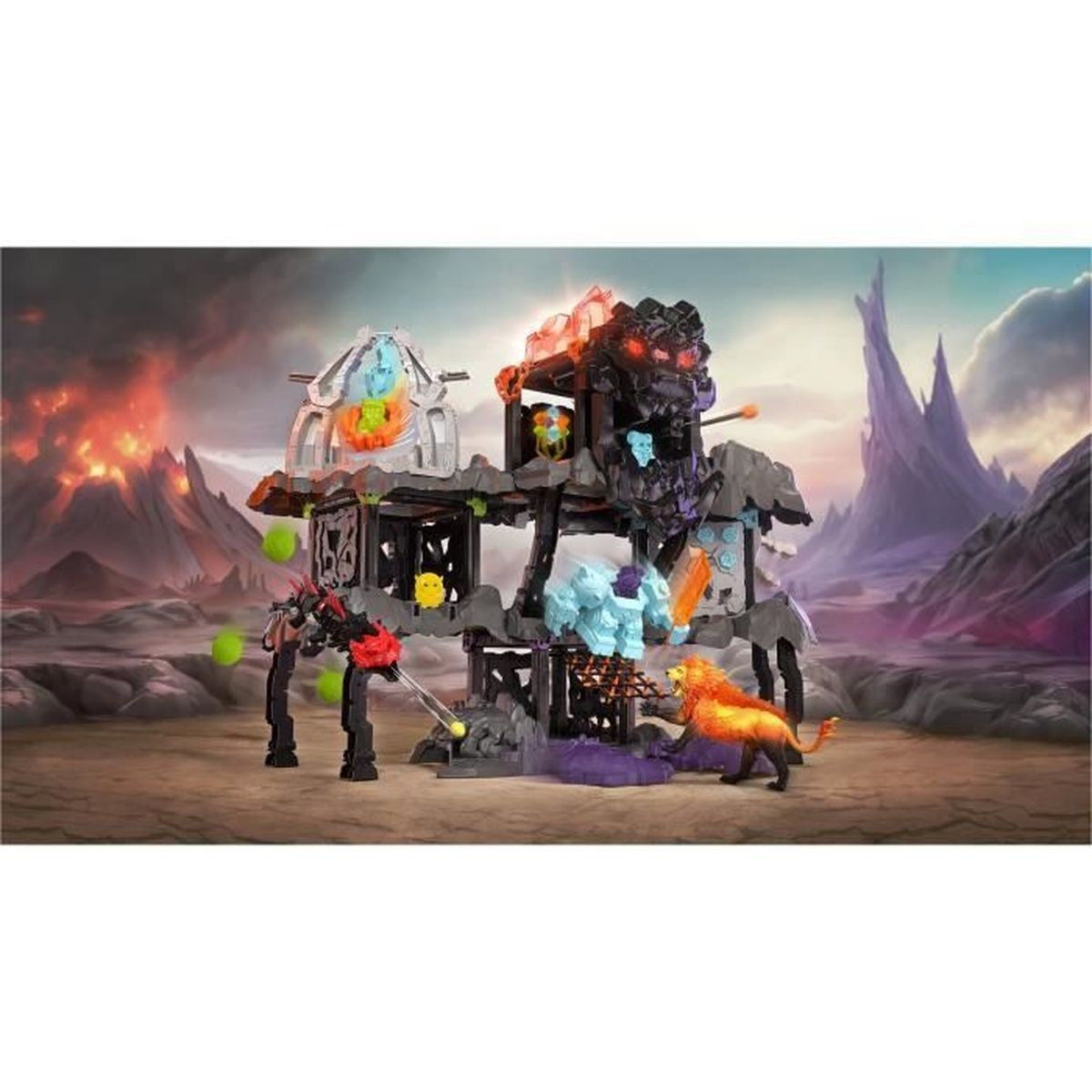 Fantasie-Spielset mit Burg und verschiedenen Kreaturen. Ein feuriger Löwe und ein blaues Monster befinden sich am Boden. Vulkan im Hintergrund.