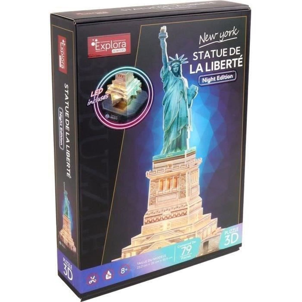 Scatola di un puzzle 3D della Statua della Libertà. È un'edizione notturna con luci a LED, la scatola è nera con testo e un'immagine della statua.