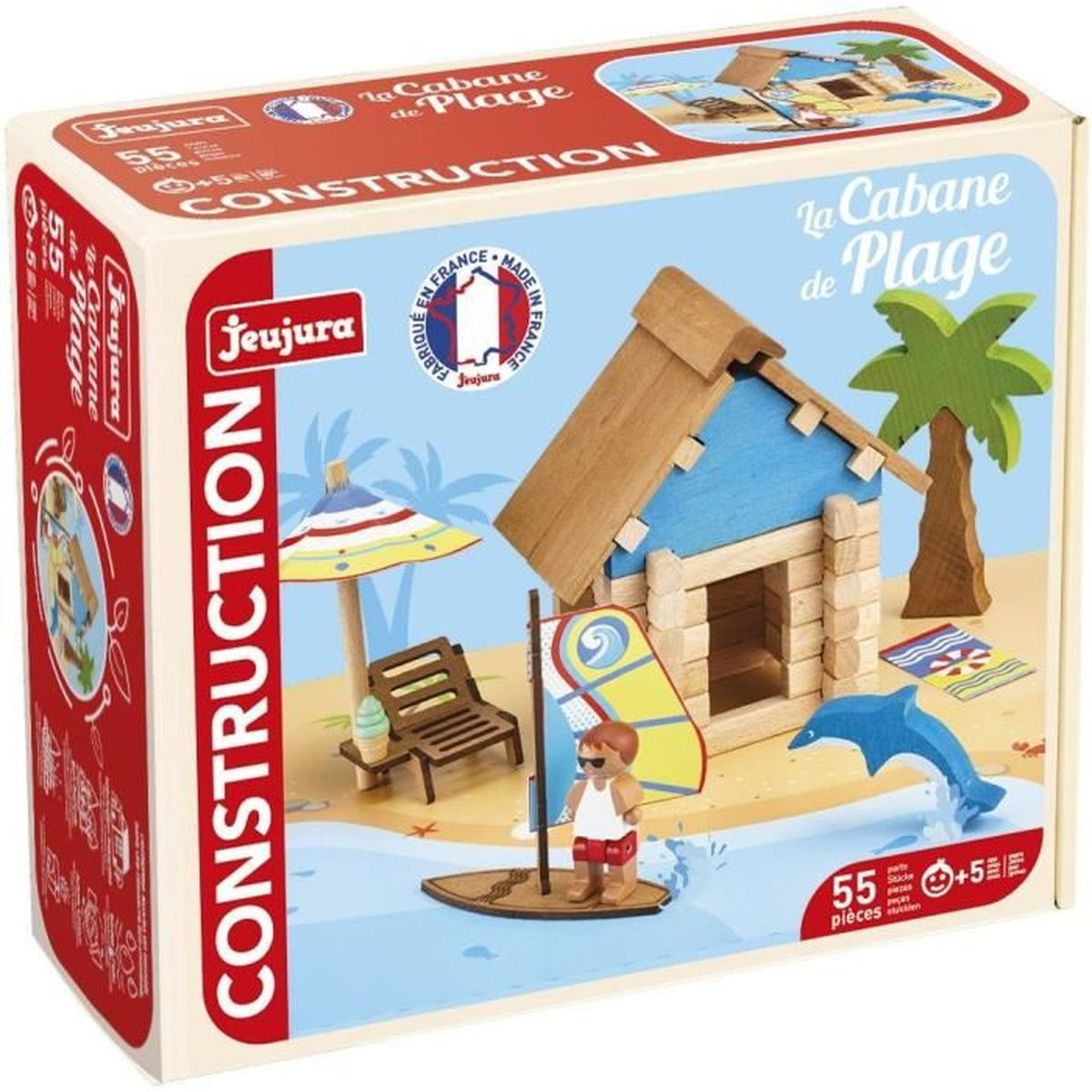 Un set di costruzioni a tema spiaggia con una casa blu, una palma, un delfino, un surfista e accessori da spiaggia su una scatola.