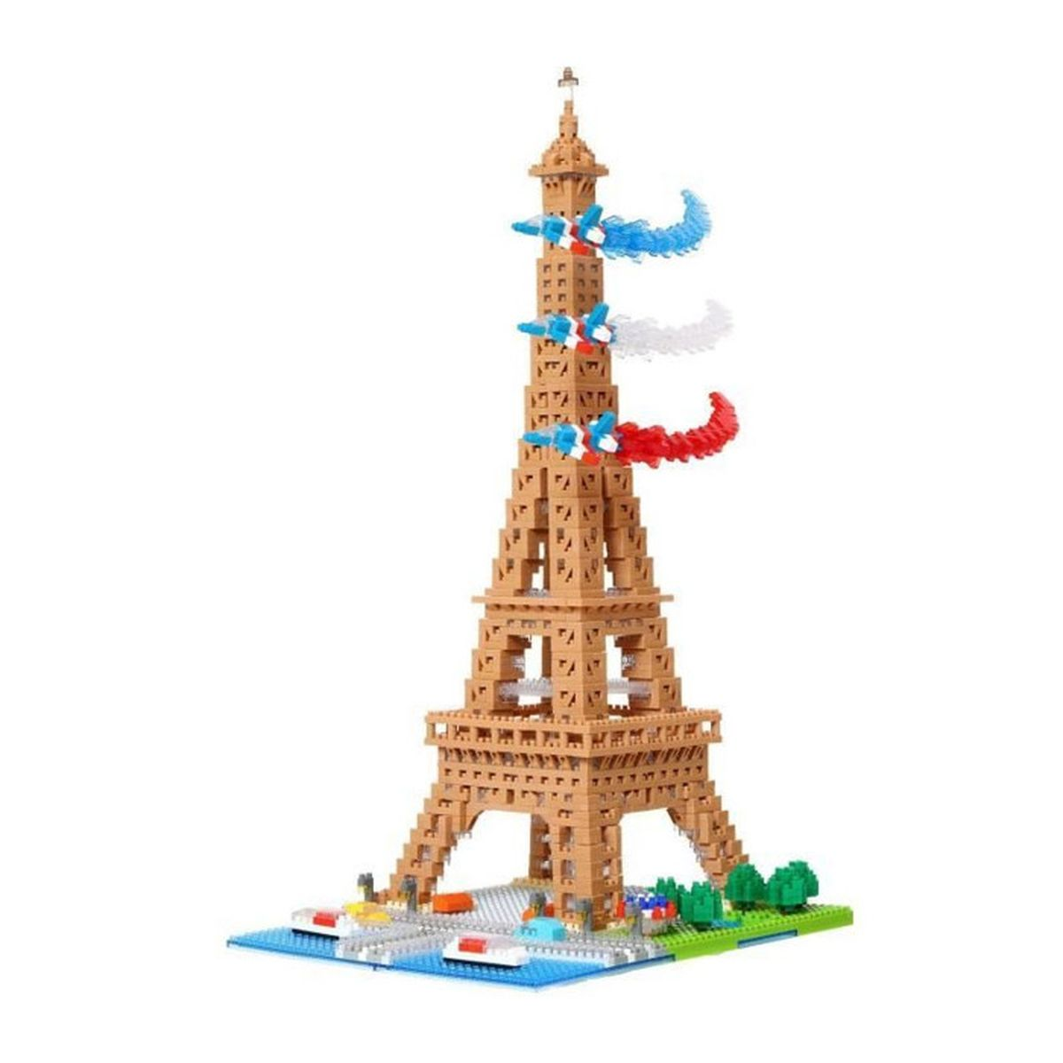 Una torre Eiffel giocattolo fatta di blocchi. Ha scie di jet blu, bianche e rosse. La base ha alberi e strade.