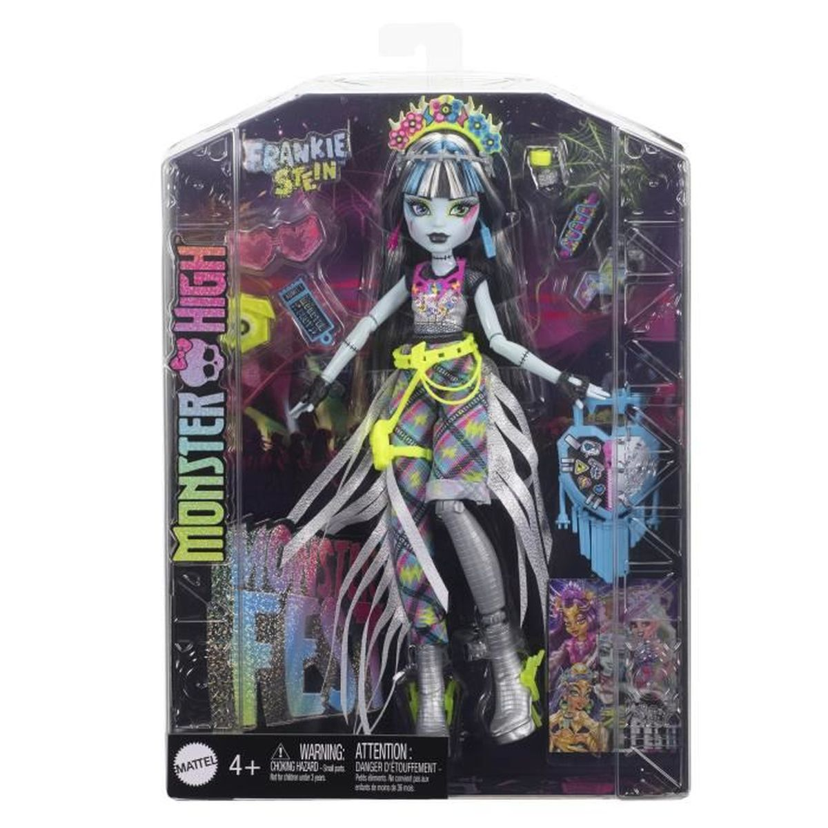 Eine Frankie Stein-Puppe in einer Verpackung. Sie hat schwarz-weißes Haar und trägt ein buntes Outfit. Die Box hat das Monster High-Logo.