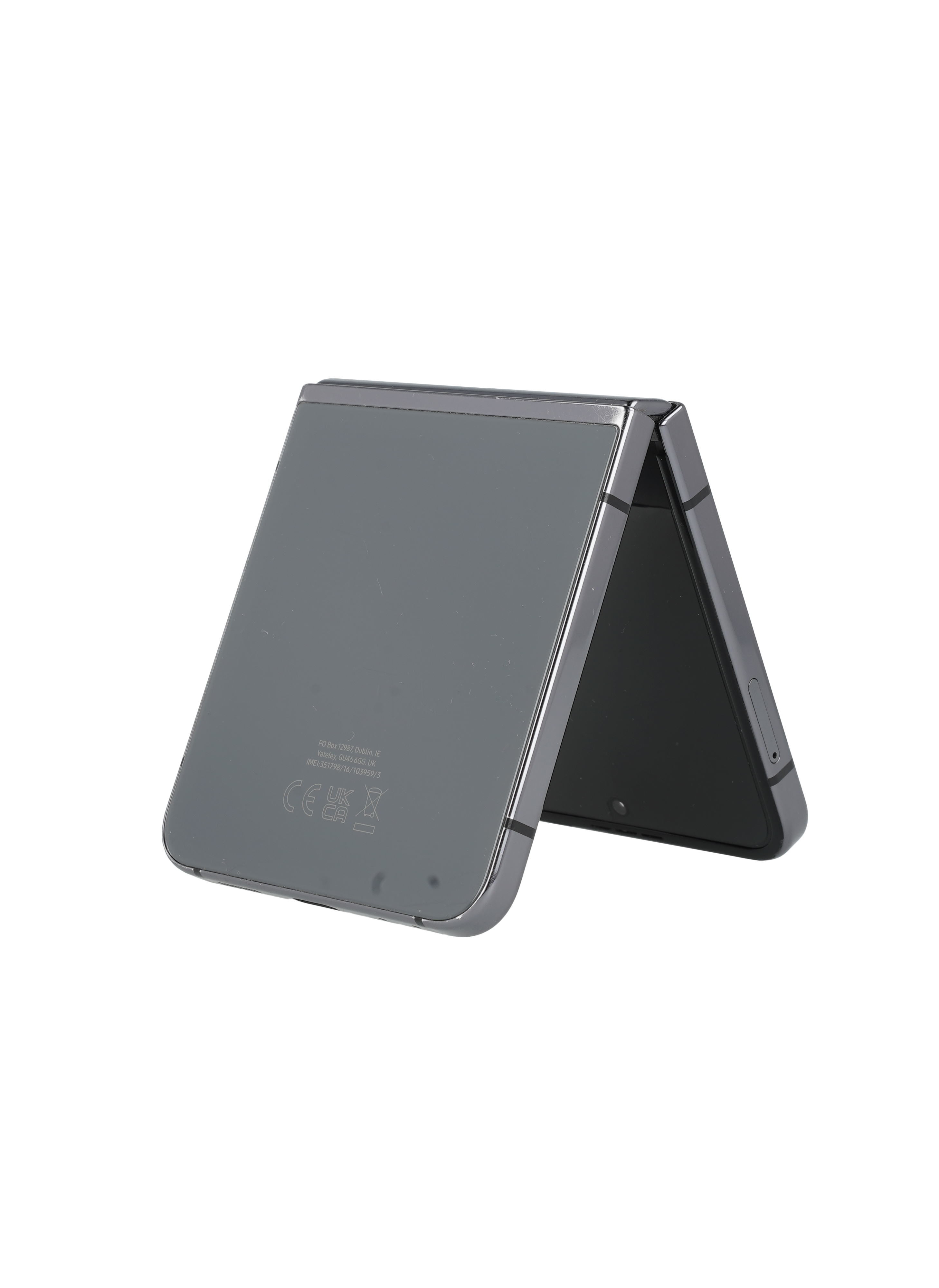 Szary, składany smartfon jest częściowo otwarty na czarnym tle. Tył ma tekst, a zawias jest widoczny.