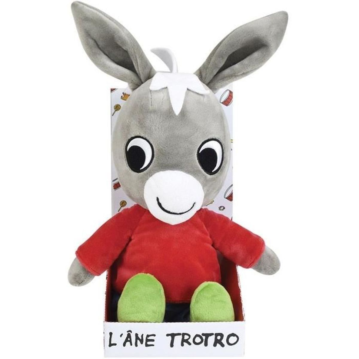 Ein Stofftier-Esel in einer Box. Er hat graues Fell, große Augen, ein rotes Hemd, grüne Füße und den Text 'L'Âne Trotro' auf der Box.