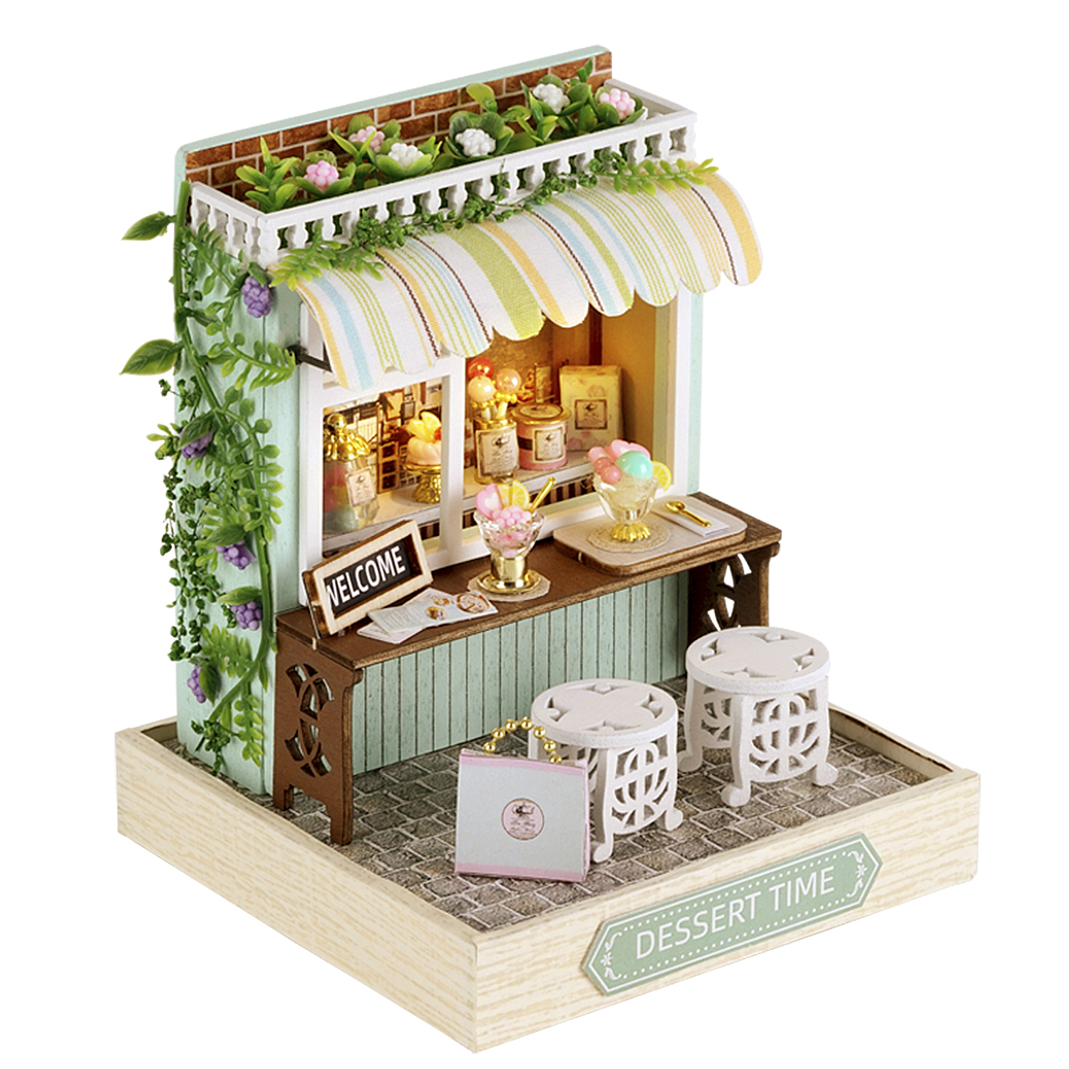 Miniatur-Dessertladen mit Markise, zwei Hockern und Willkommensschild. Enthält Desserts wie Eiscreme. Grüne und weiße Akzente.