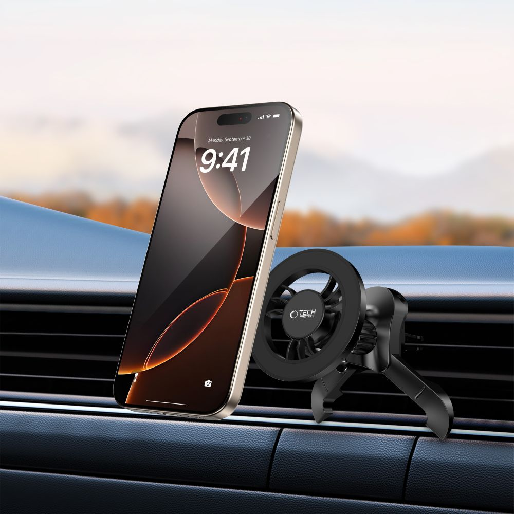 Ein Smartphone ist an einer Lüftungsöffnung im Auto befestigt. Das Telefon zeigt 9:41 Uhr an und ist goldfarben. Eine schwarze Halterung ist befestigt.