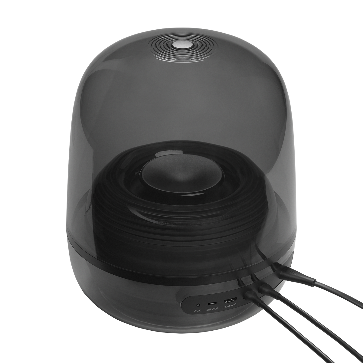 Ein moderner, transparenter Lautsprecher mit schwarzem Innenraum. Kabel kommen unten heraus. AUX-, SERVICE- und HDMI ARC-Anschlüsse sind sichtbar.