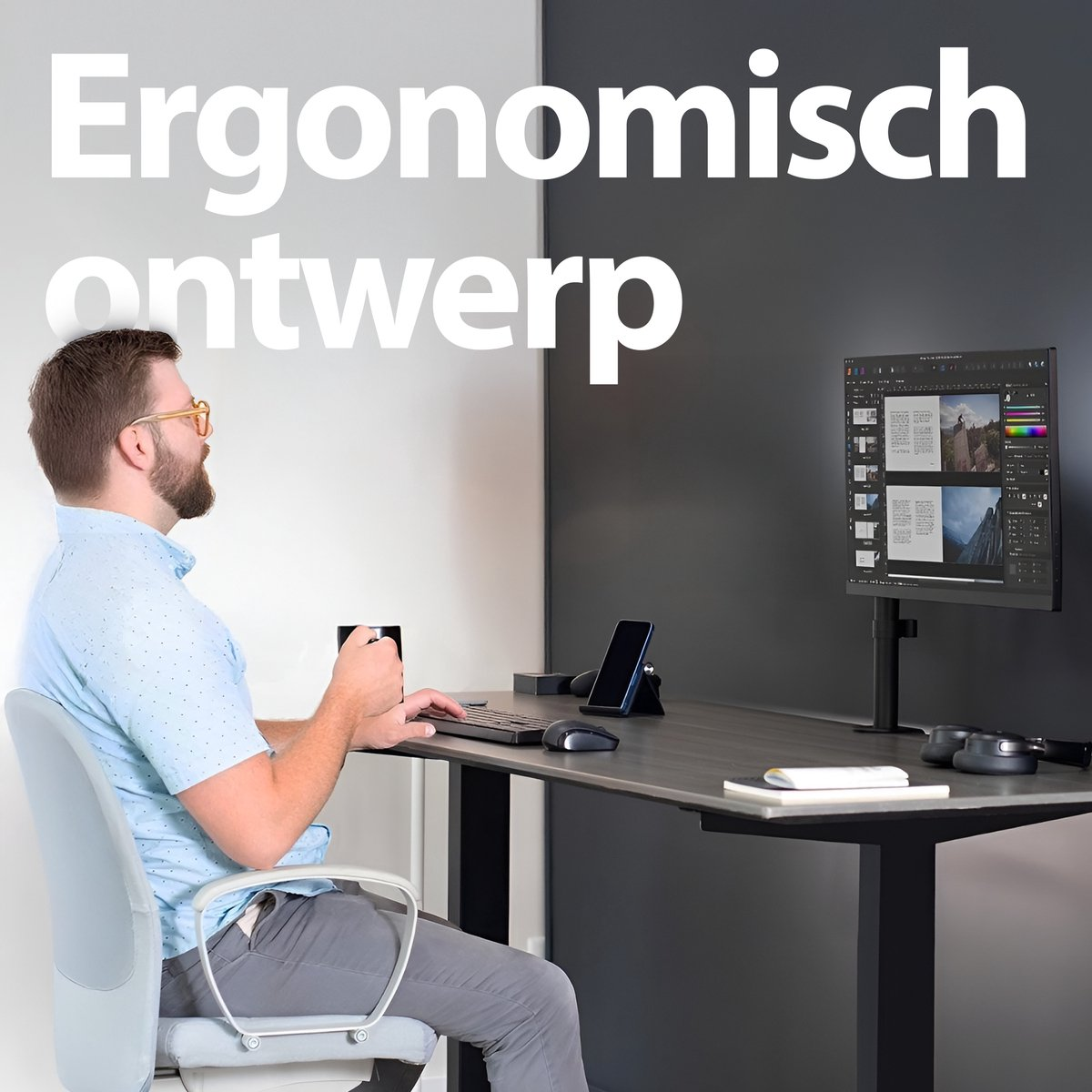 A man sits at a desk, looking at a computer screen. He holds a mug. The desk has a keyboard and mouse. Text above says 'Ergonomisch ontwerp'.