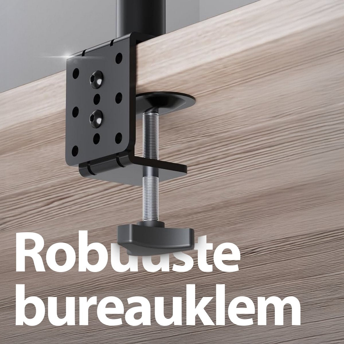 A black desk clamp is attached to a wooden surface. The clamp has a threaded rod and a knob for tightening.