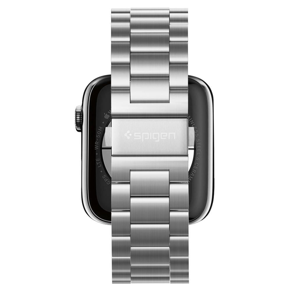 Apple Watch argentato con cinturino in metallo, vista posteriore. Il logo Spigen è visibile. Sono visualizzati GPS, LTE e WR-50M.