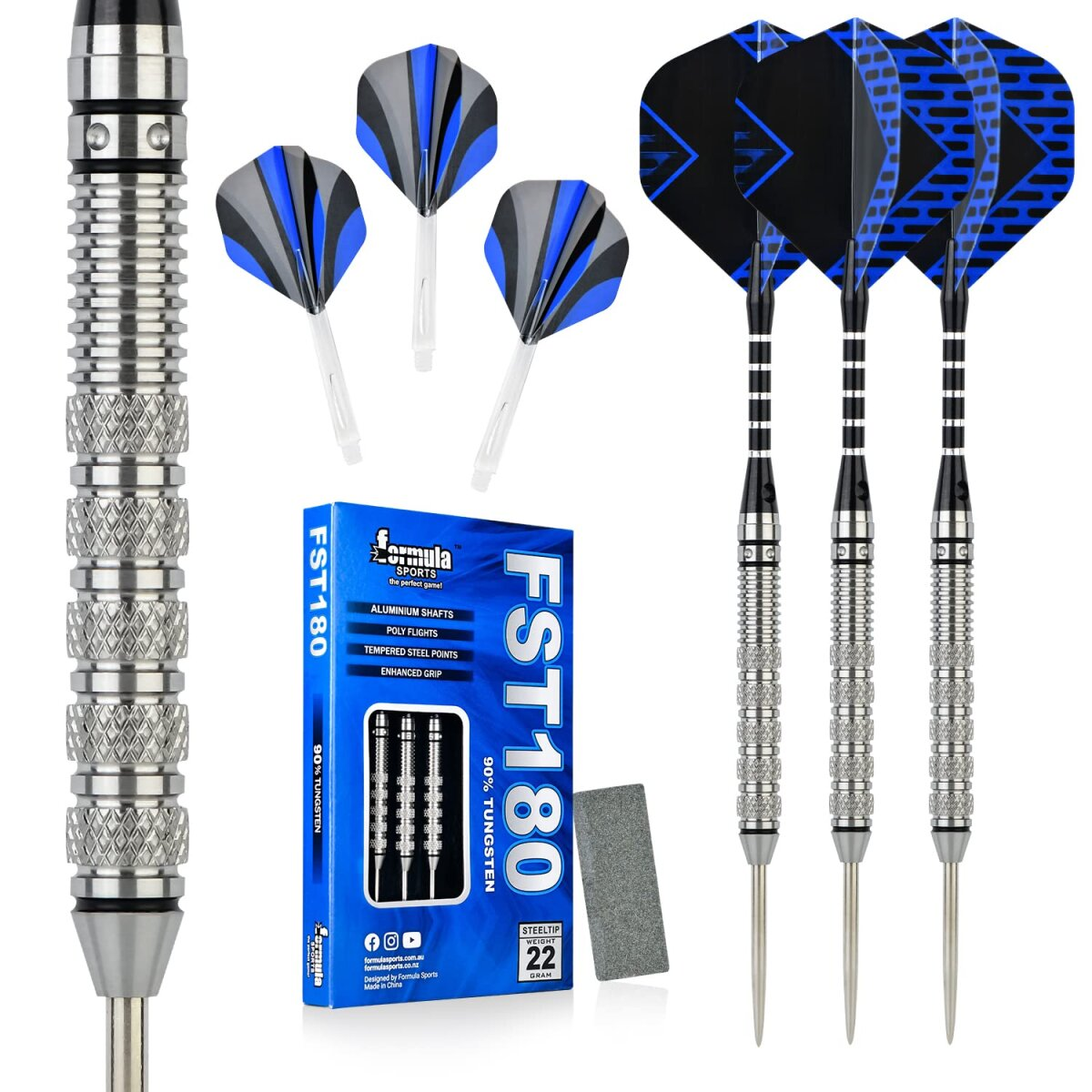 A set of darts with blue and black flights, a box of FST180 darts, and a sharpening stone. All on a white background.