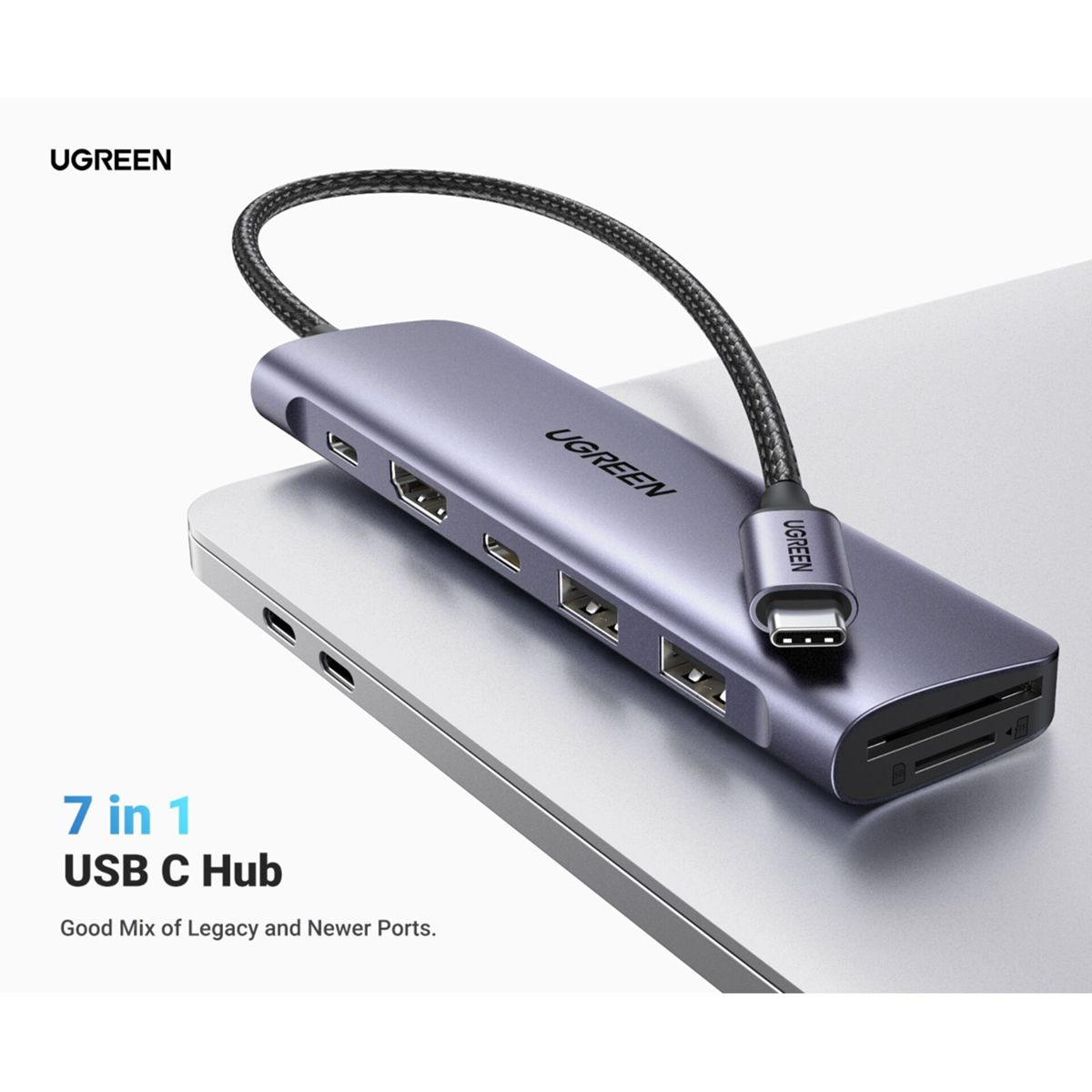 Ein UGREEN 7-in-1 USB-C-Hub, grau, an einen Laptop angeschlossen. Text: 'Guter Mix aus älteren und neueren Ports'.
