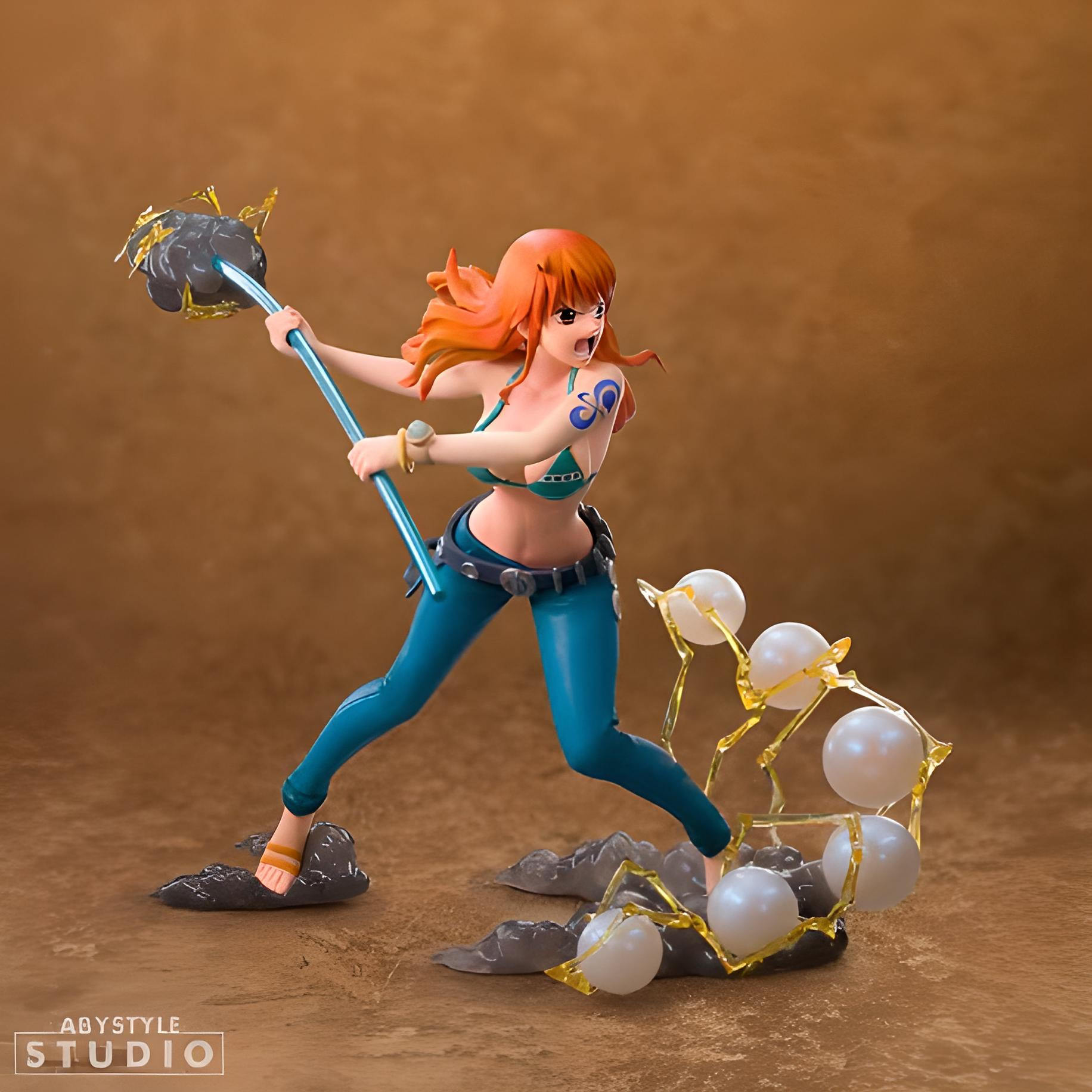 Anime-Figur einer Frau mit Stab und Energiebällen. Oranges Haar, blaues Outfit und ein Tattoo am Arm.