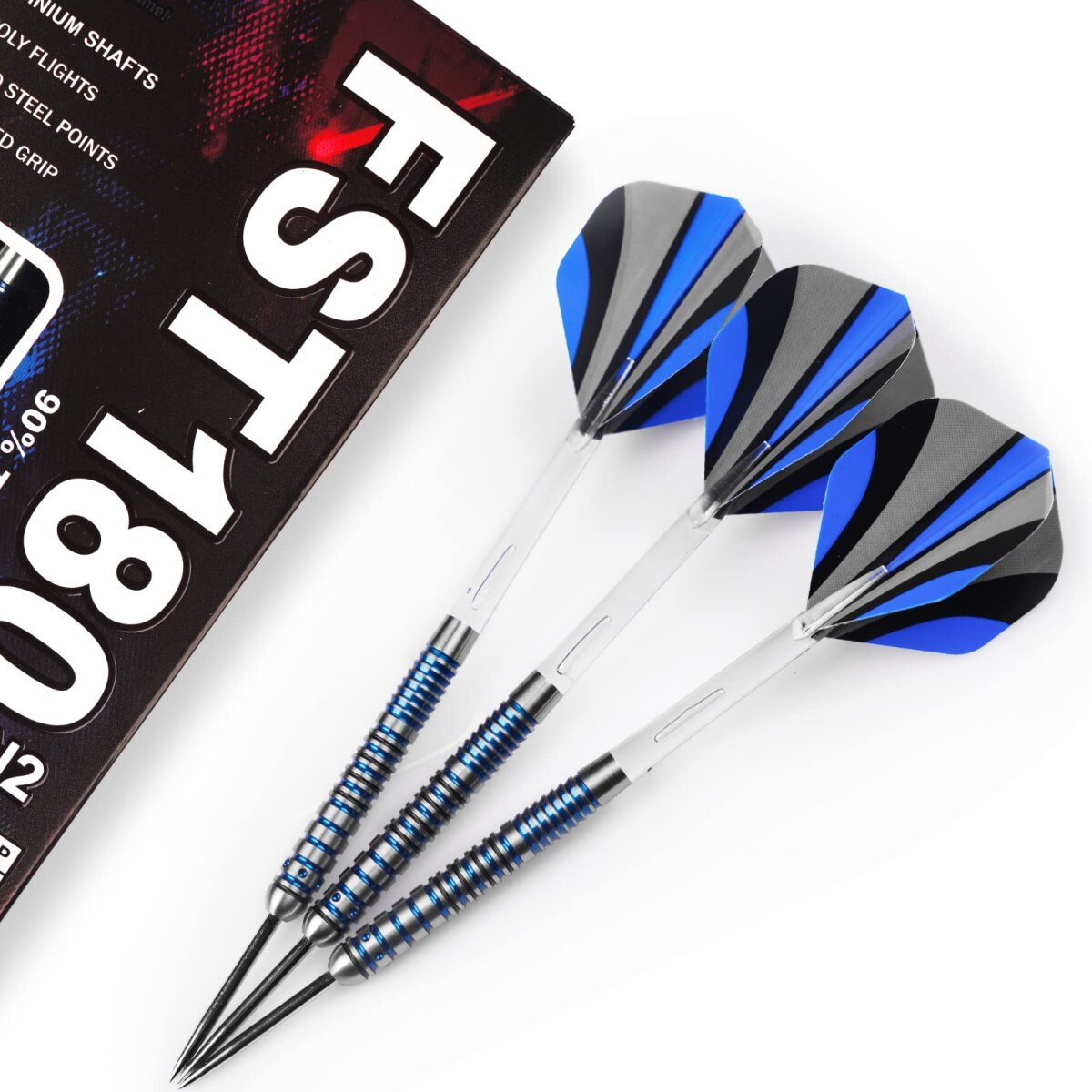 Three darts with blue and black flights are on a white surface next to a box with text.