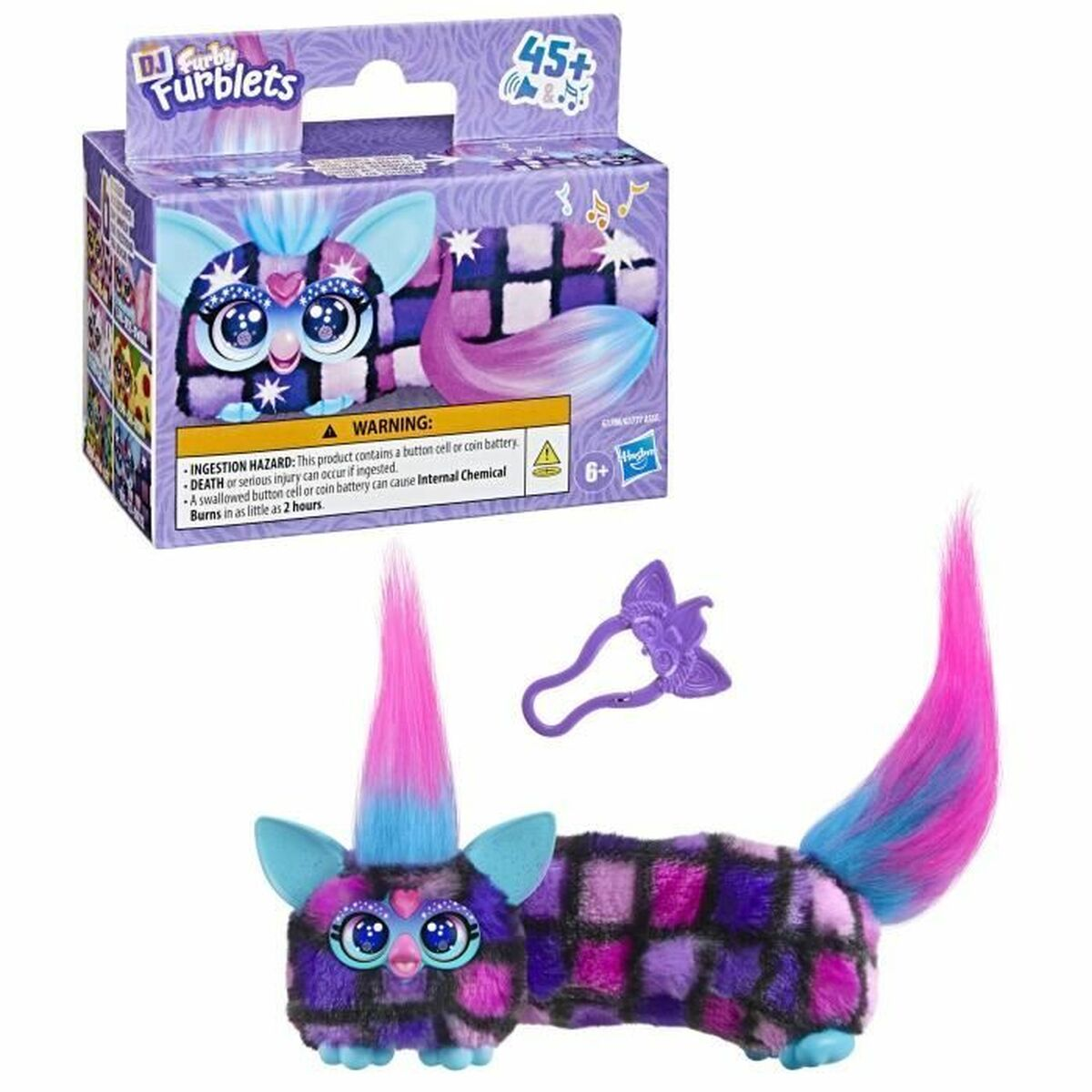 Ein Furblets-Spielzeug mit rosa und blauem Fell, einem lilafarbenen Schwanz und einer Schachtel mit derselben Figur. Ein lila Haaraccessoire.