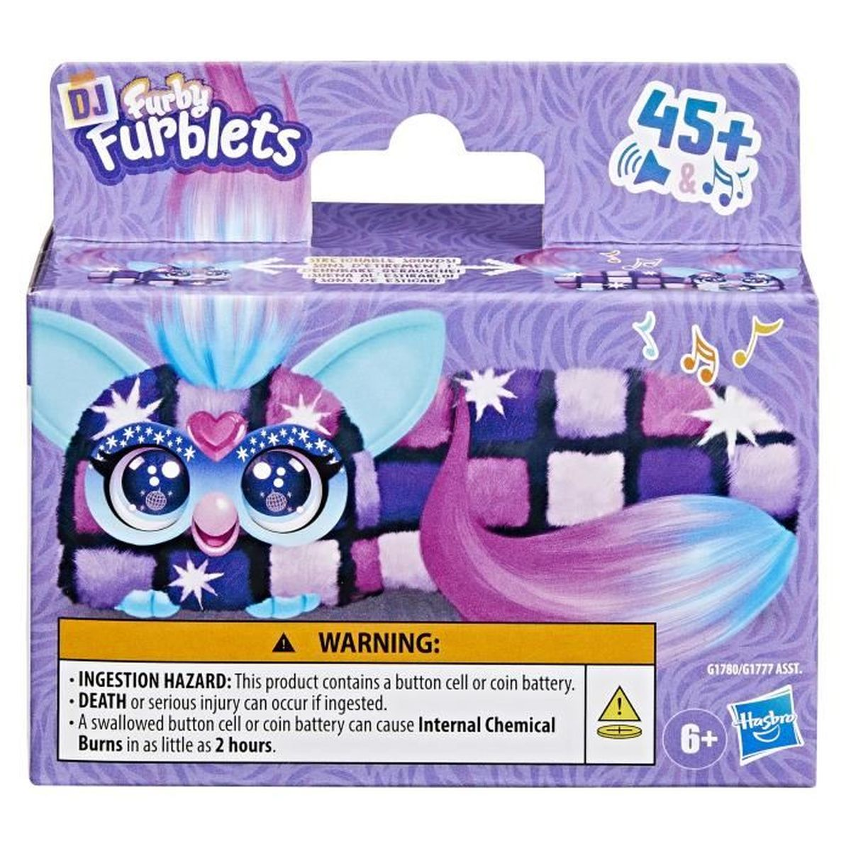 Auf der Verpackung von Furby Furblets ist ein Furby-Design abgebildet. Auf der Verpackung befindet sich eine Warnung vor Verschluckungsgefahr.
