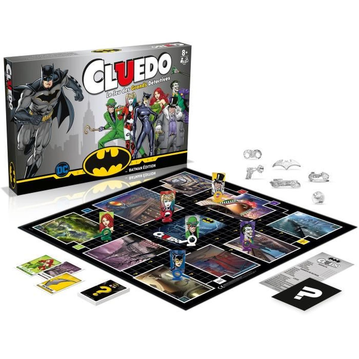 Ein Batman Cluedo Brettspiel. Die Schachtel zeigt Batman und Schurken. Das Spielbrett hat Spielfiguren. Karten und Spielsteine sind verstreut.