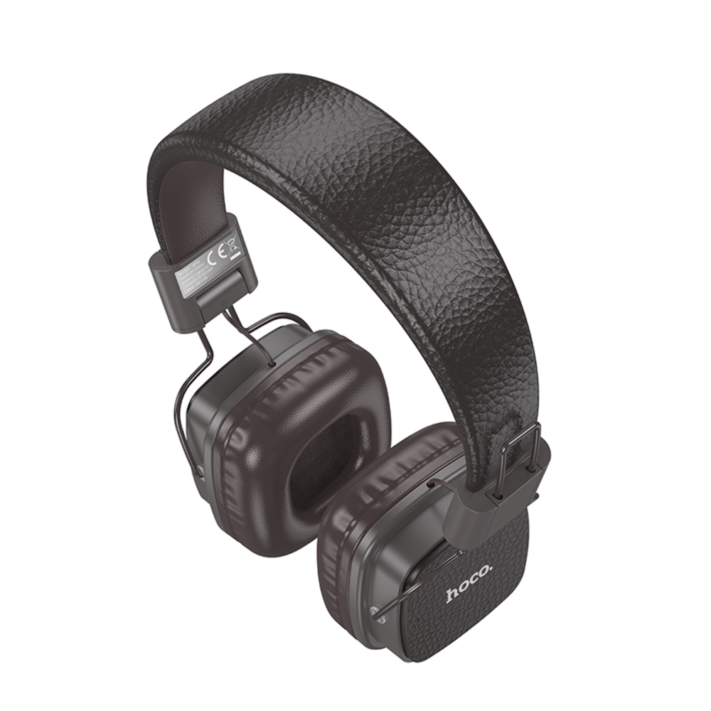 Auriculares supraaurales con almohadillas marrones y diadema gris oscuro. La marca 'hoco.' es visible.