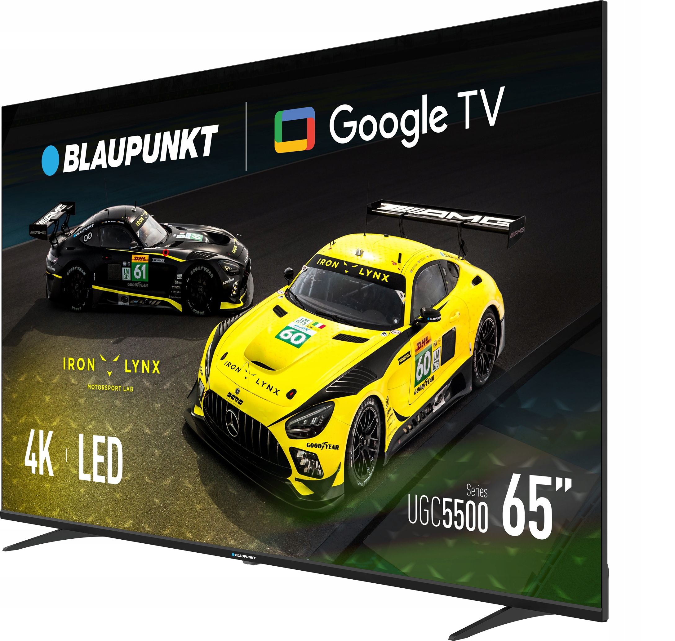 Telewizor Blaupunkt wyświetla dwa samochody wyścigowe: czarny i żółty. Logo Google TV na górze. Na ekranie napis 4K LED i 65".