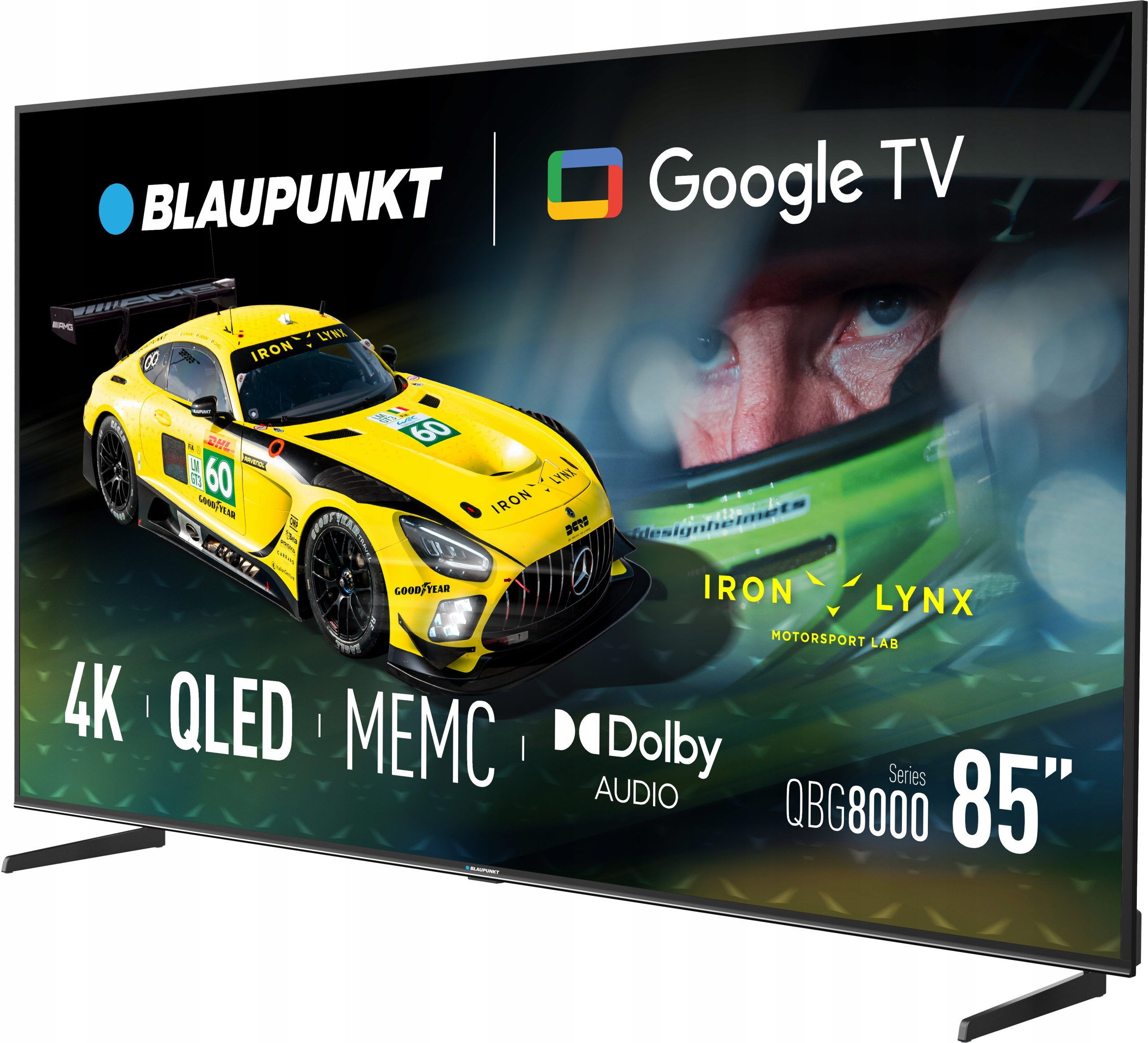 Duży telewizor wyświetla żółty samochód wyścigowy i twarz kierowcy. Na ekranie widnieją napisy Blaupunkt, Google TV, 4K QLED i 85 cali.