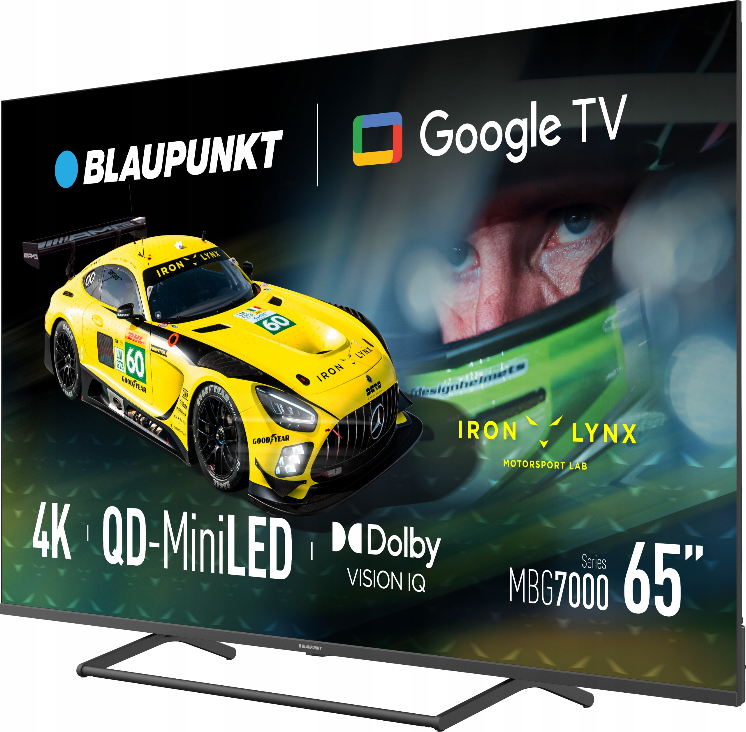 Un'auto da corsa gialla sullo schermo di una TV. Lo schermo è un Google TV Blaupunkt 65". Loghi e testo visibili.