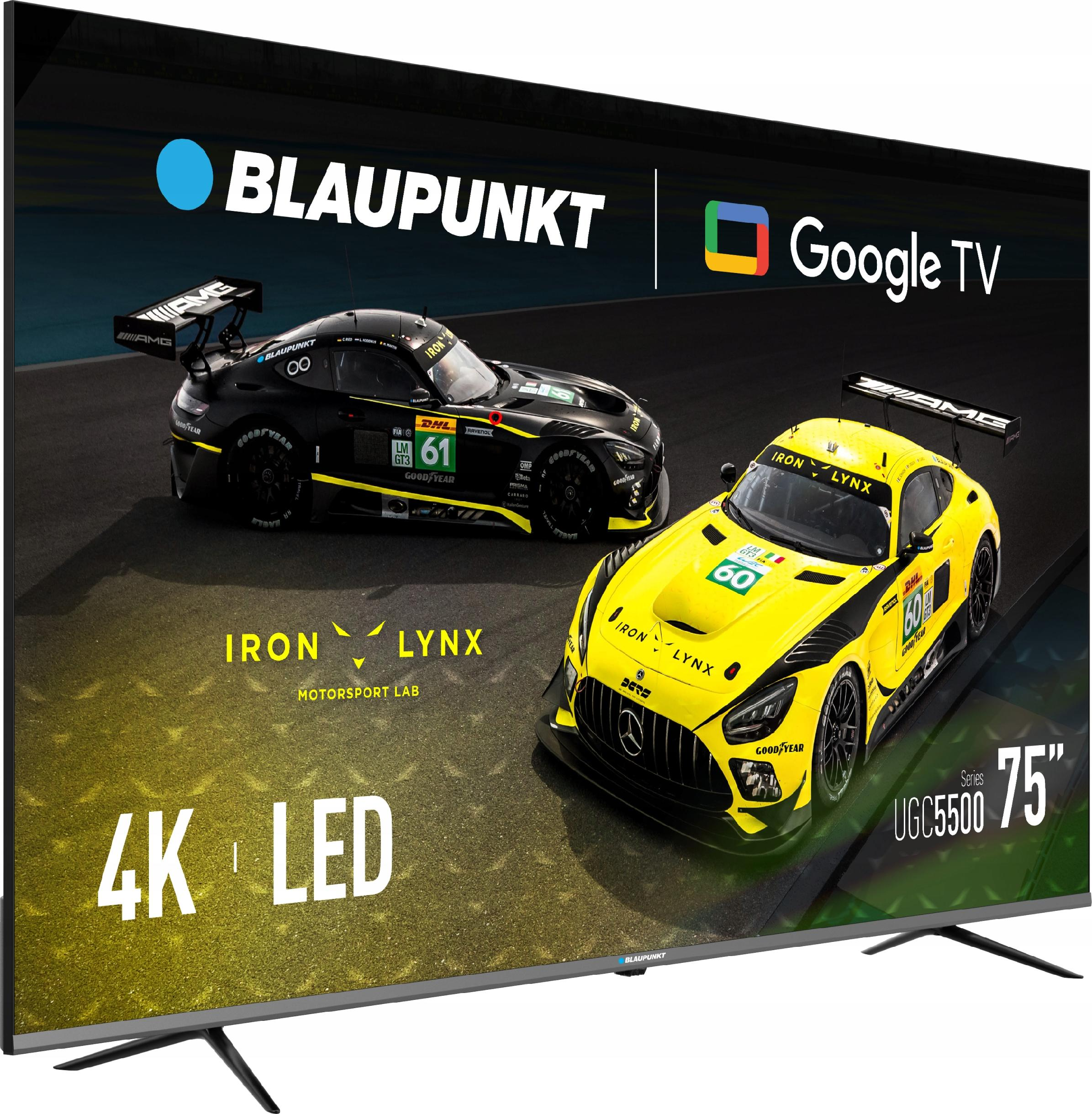 Ekran telewizora wyświetla dwa samochody wyścigowe, jeden czarny i jeden żółty. Pokazuje 'Blaupunkt', 'Google TV' i '4K LED'.