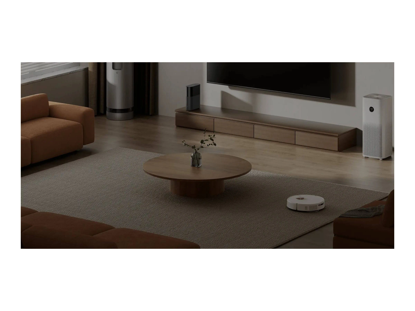 Living room with sofa, coffee table, TV, air purifier, and robot vacuum. Neutral colors with modern design.