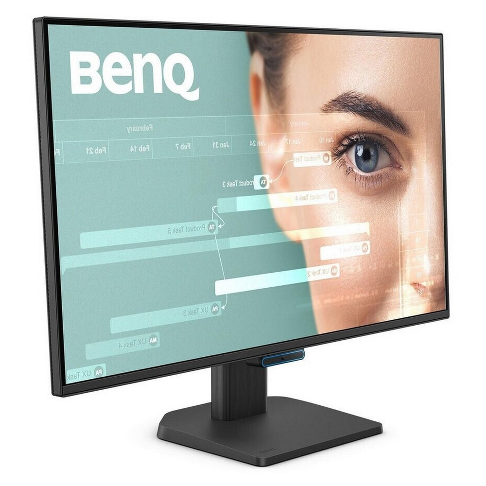 A computer monitor displays a woman's eye and business data. The monitor is black, with a black stand and a BenQ logo.