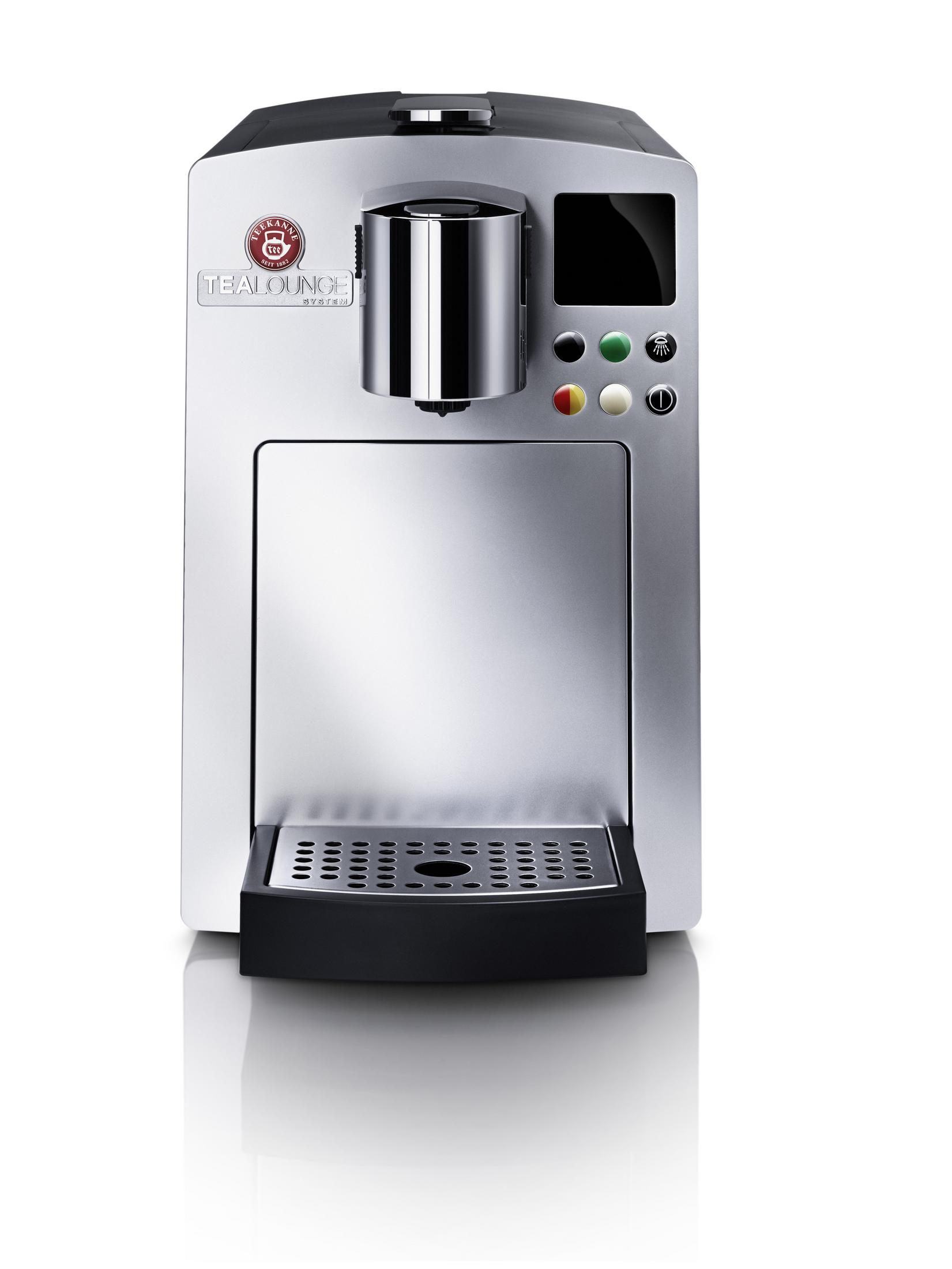 Silberne Teemaschine mit schwarzem Sockel und Knöpfen. Sie hat einen Bildschirm und ein Logo mit der Aufschrift 'TEALOUGE SYSTEM'.
