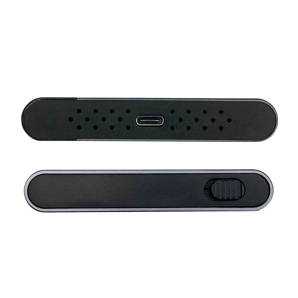 Dwa czarne urządzenia, jedno z otworami i portem USB, drugie z suwakiem. Oba mają zaokrąglone krawędzie.