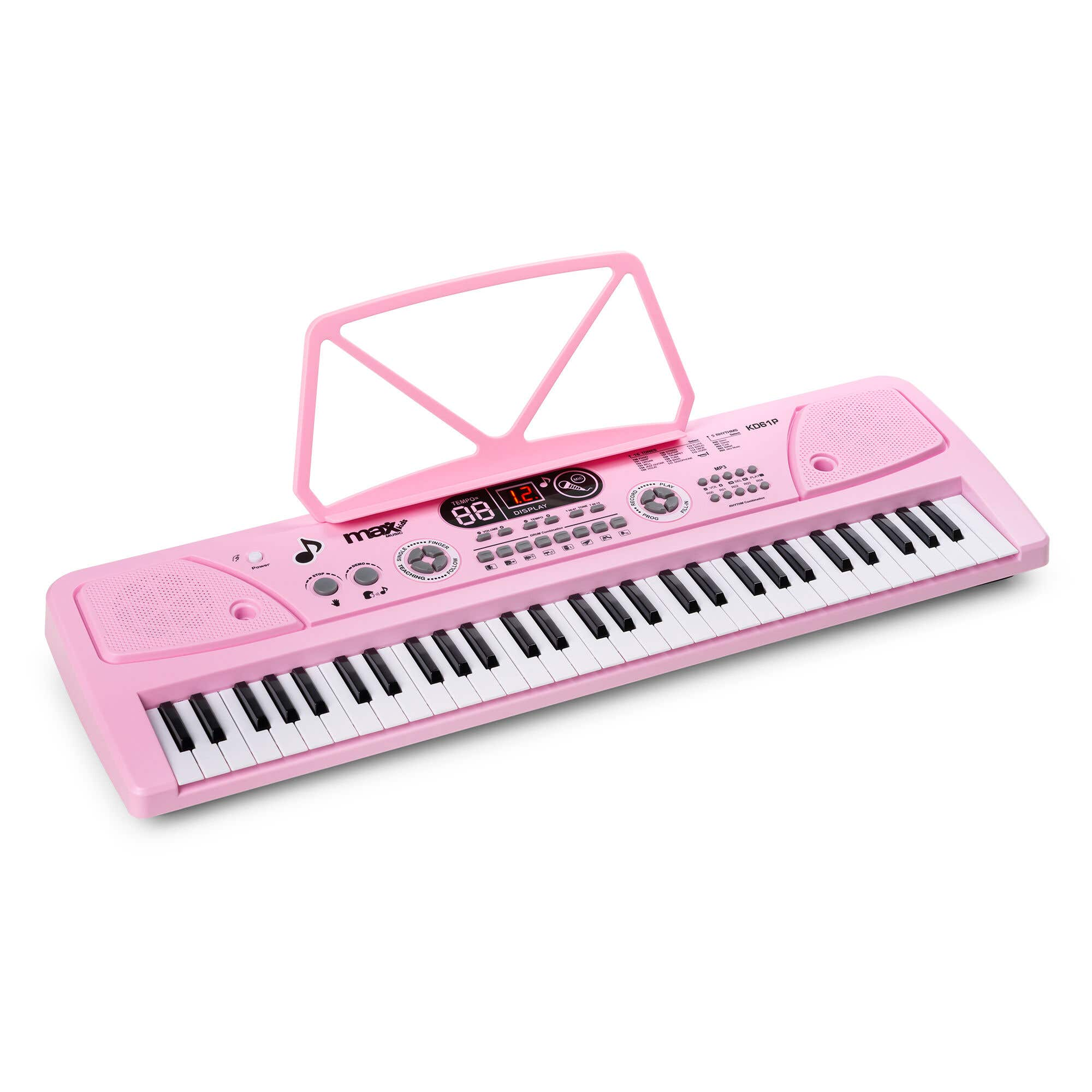 Un piano de juguete rosa con teclas blancas y negras, altavoces y un atril. El fondo es blanco.