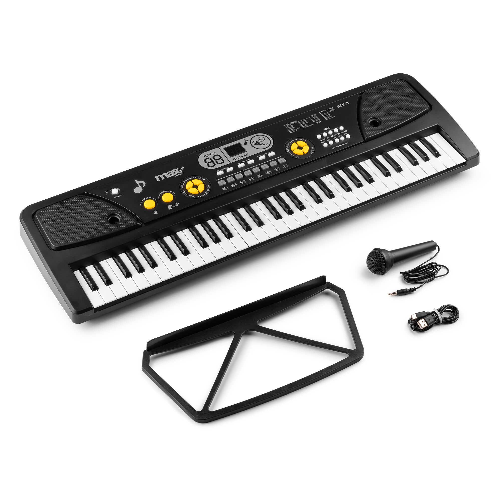 Teclado negro para niños con teclas blancas, micrófono, soporte y cable USB sobre blanco. El teclado tiene pantalla.