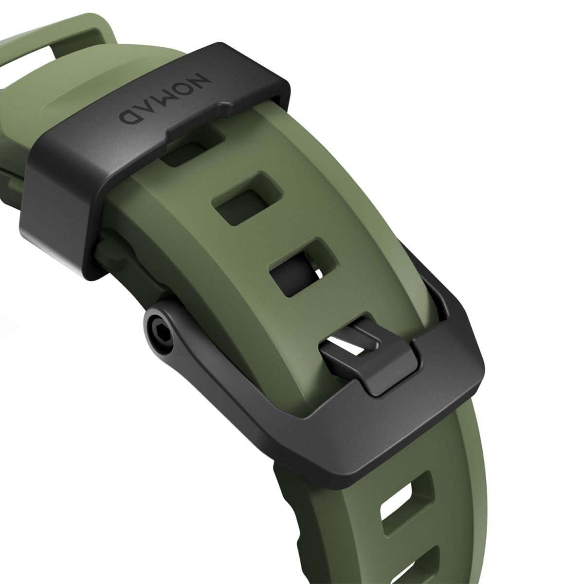 Primer plano de una correa de reloj verde con un cierre negro. La correa tiene la marca 'NOMAD' y un diseño rectangular.