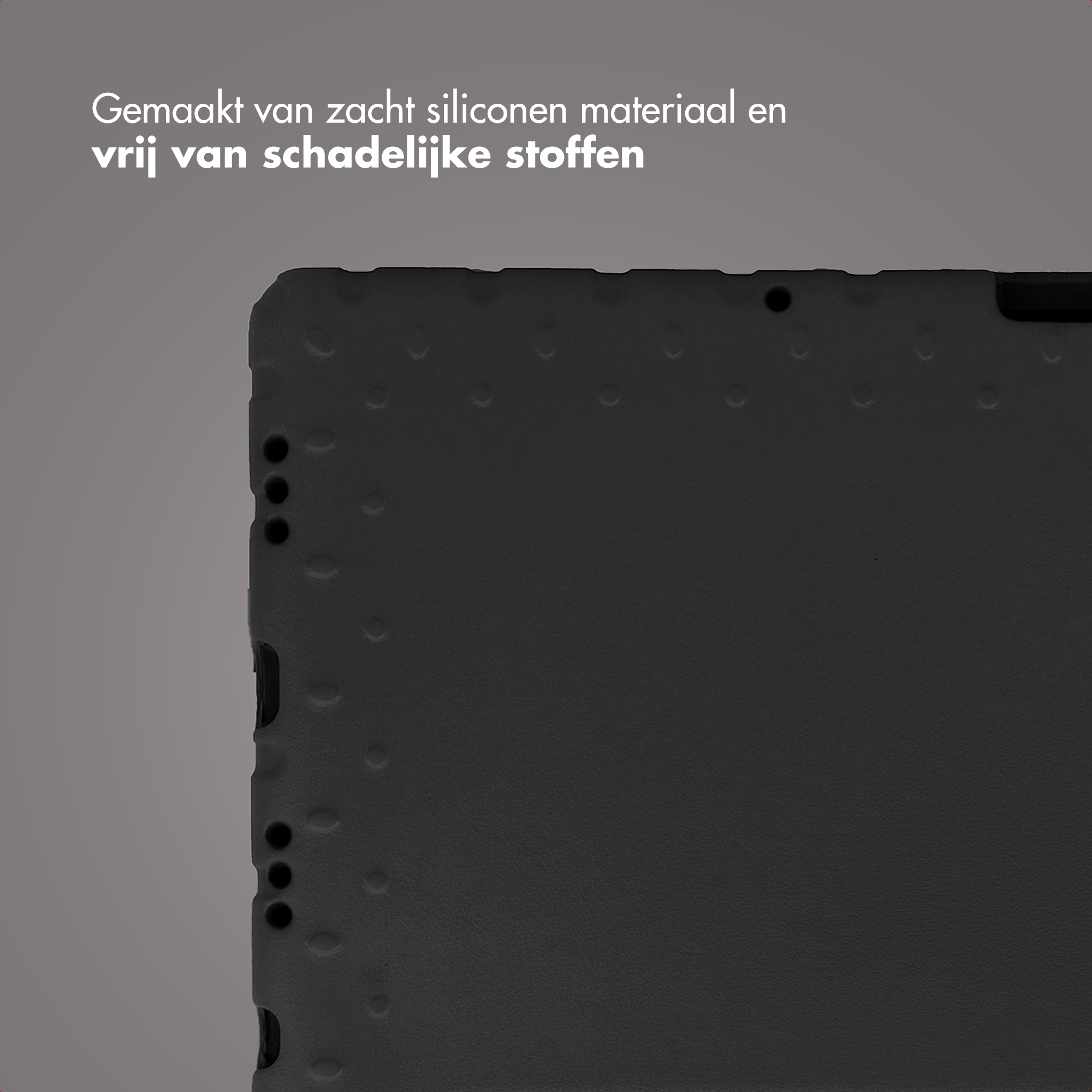 Close-up of a black tablet case. The case has a textured surface with small circular indents.