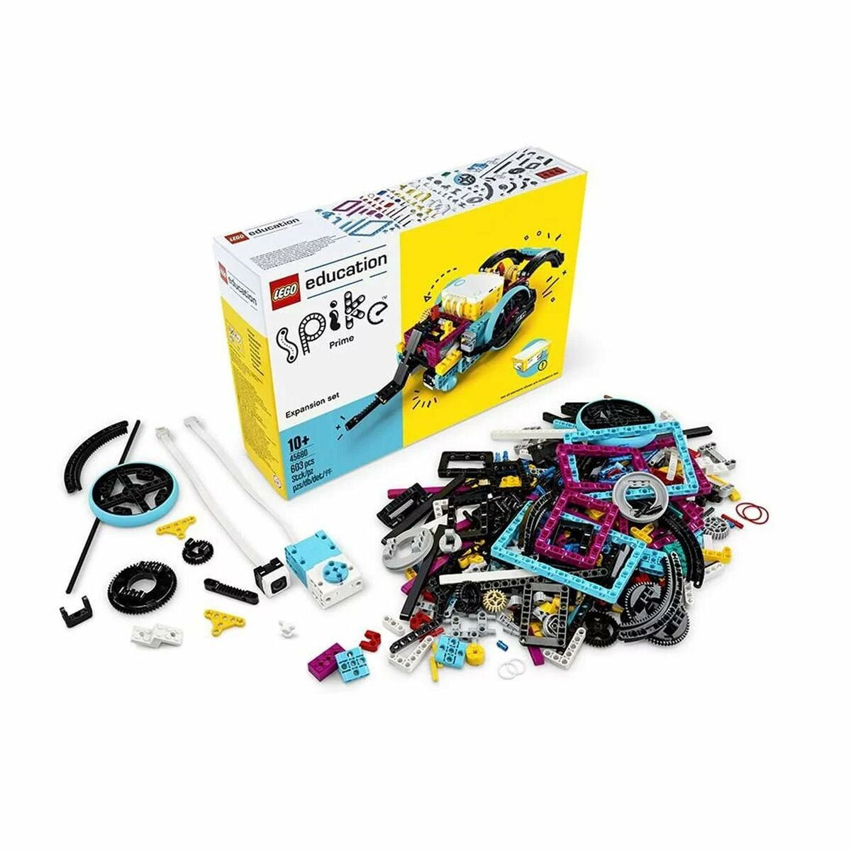 Un set de expansión LEGO Spike Prime. La caja muestra un diseño de robot. Piezas LEGO dispersas en varios colores, incluyendo azul, negro y amarillo.