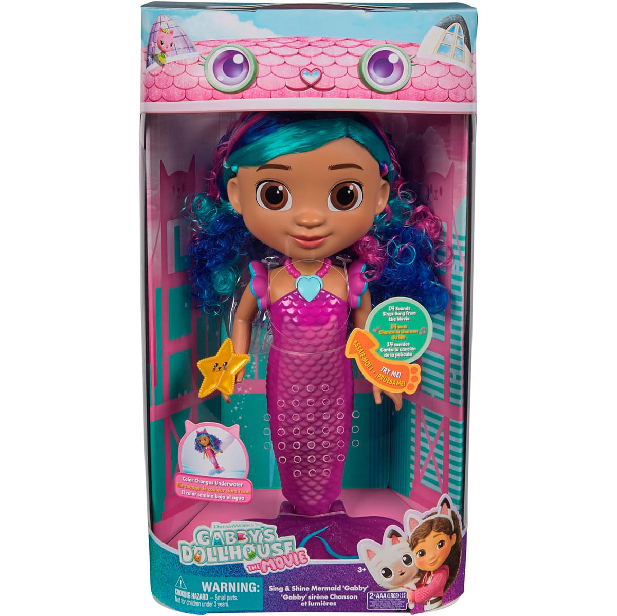 Eine Gabby's Dollhouse Meerjungfrauenpuppe in einer Box. Sie hat blaues und lila Haar, einen rosa Meerjungfrauenschwanz und einen Seestern.