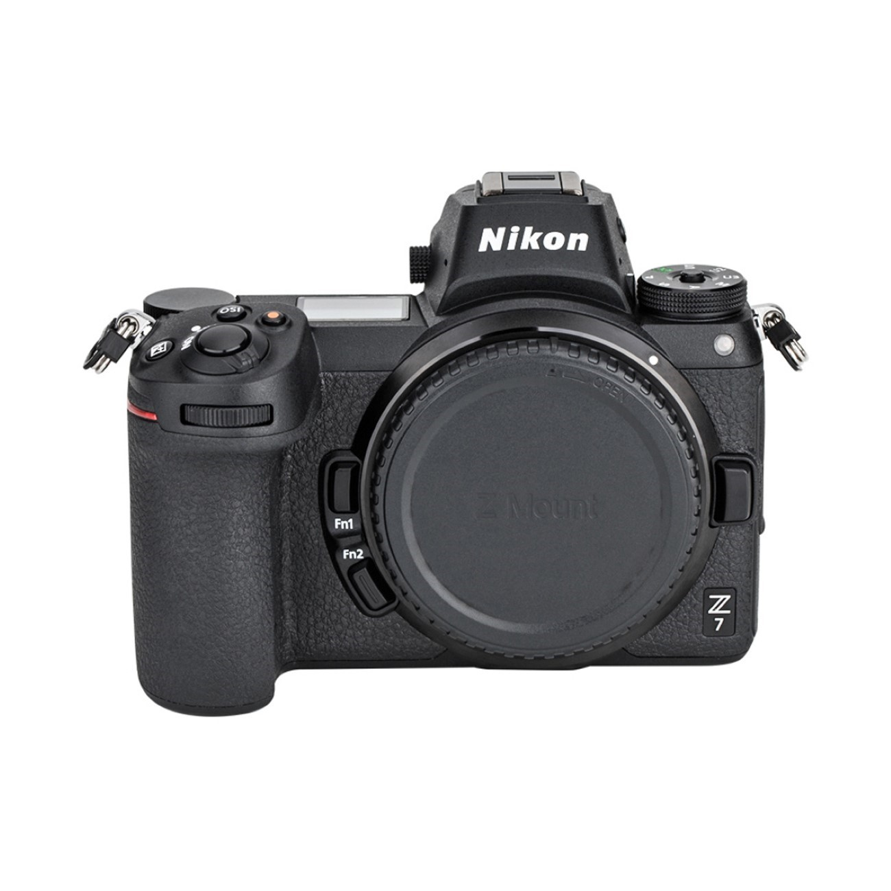 Eine schwarze Nikon Z 7 Kamera mit Objektivdeckel. Knöpfe und Räder sind sichtbar. Die Kamera befindet sich auf weißem Hintergrund.